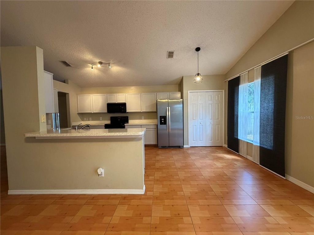 Photo of 13726 Meadowpark Avenue, Orlando, FL 32826 (MLS # R4910961)