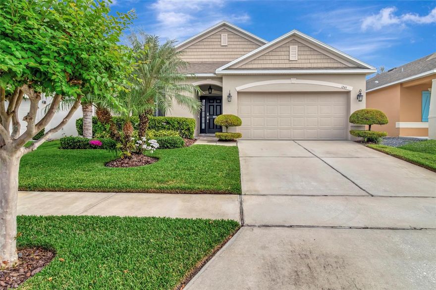 Welcome to this charming 3-bedroom, 2-bathroom home located in the desirable Lake Douglas Preserve neighborhood in Groveland, just minutes from Clermont’s shopping, dining, and entertainment. Step inside to find wood plank tile flooring throughout the main living areas and  carpet in the three bedrooms. Upon entry, two spacious bedrooms and a full bathroom with a tub/shower combo and granite countertops are conveniently located to the left. Further down the hall, you’ll discover a bright and open floor plan combining the kitchen, dining area and living room. Enjoy serene views of the beautifully landscaped, private, fenced-in backyard. The well-appointed kitchen features an island with granite countertops, 42-inch white cabinetry, stainless steel appliances and a refrigerator that’s just one year old. The primary suite offers a generous walk-in closet and an en suite bathroom with dual sinks, a walk-in shower and a relaxing garden tub. The home’s neutral paint palette enhances the light, airy feel throughout. Relax on the screened-in, covered back patio with privacy shades, perfect for morning coffee or evening gatherings. The garage includes a ceiling fan, lighting, and painted flooring, making it ideal for a home gym or workshop.
Additional upgrades include a digital smart irrigation system, smart garage app and smart thermostat. The property boasts excellent curb appeal with well-maintained landscaping. Conveniently located off Highway 50, close to Clermont, hospitals, schools, the Florida Turnpike and Highway 27—this home offers the perfect blend of comfort, style, and convenience.