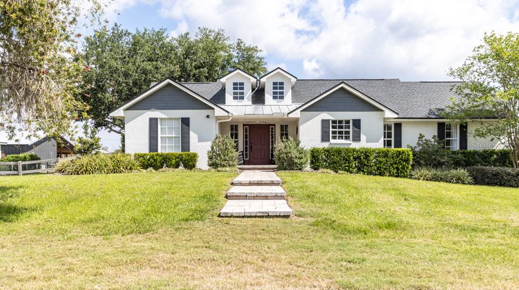 Welcome to this 3/2 beautifully renovated and updated modern farmhouse with bonus room on almost 6 fully fenced and cross fenced and maintained acres including barn, outdoor kitchen, workshop, storage shed, chicken coop, garden, horse round pen and so much more!
This home has it all and is surrounded by 7000 acres of park land with riding trails, abundant wildlife, nature views, and PRIVACY!
As you enter the gated, private drive, you will see the house nestled far away from the road toward the middle of the property, with the barn, workshop, outdoor kitchen, and shed all in close proximity to the home, and expansive pastures in the front and back.
The home has a thoughtfully designed floor plan, ceramic tile throughout, vaulted ceiling in great room, and tons of natural light. The design flows seamlessly from indoor to outdoor through the covered, paved patio with screen enclosure.
Once outside, you will enter the large, pavered courtyard with six foot wide wood burning stone firepit with seating for eight, surrounded by lush landscaping and mature oak trees. This massive open area is perfect or entertaining and leads you to the outdoor kitchen and barn.
This one-of-a-kind property has room for everything and there is no HOA or CDD. So bring your toys, horses, goats, and chickens! This property is ready for it all! This home is designed for peace, privacy, functionality, and is perfect for homesteading, equestrian use, or a hobby farm. This one is a must see!
Highlights and recent upgrades include:
- new roof, AC, and upgraded attic insulation in 2020
- entire property fenced and cross fenced, fully replaced in 2022
- new water softener, well pump, pump rely, pump capacitor, and pump pressure switch in 2023
- new exterior house paint, pillars, and cross boards on front entrance in 2023
- new drain field, partial interior paint, and master bath remodel in 2024
- meticulously landscaped
- cafe lights throughout barn and backyard
- enclosed chicken coop with two 25lb feeders, automatic waterer, 6 nesting boxes, an 12 x 72 enclosed yard
- 24 x 36 workshop with electrical
- 12x36 insulated air conditioned storage shed with metal shelving
- 48 x 36 lofted barn with new epoxy flooring, air conditioned office and workout room, tack room, outdoor kitchen, bar, and entertainment area, enclosed stall with covered paddock, automatic waterer, and separate fenced yard.
- outdoor kitchen and bar with 32 inch ss built in grill, 22 in mini fridge, ss built in double sided griddle/burner combo, solid slab granite countertops, ss undermount sink and faucet, and polymer cabinetry accents.
- barn and outdoor kitchen wired with its own wifi
- 4 space covered, pavered parking between barn and workshop for cars, tractors, and toys
- 6x 12 garden with automatic, micro-drip irrigation and a dedicated planting area with large potting table
- round pen in back pasture