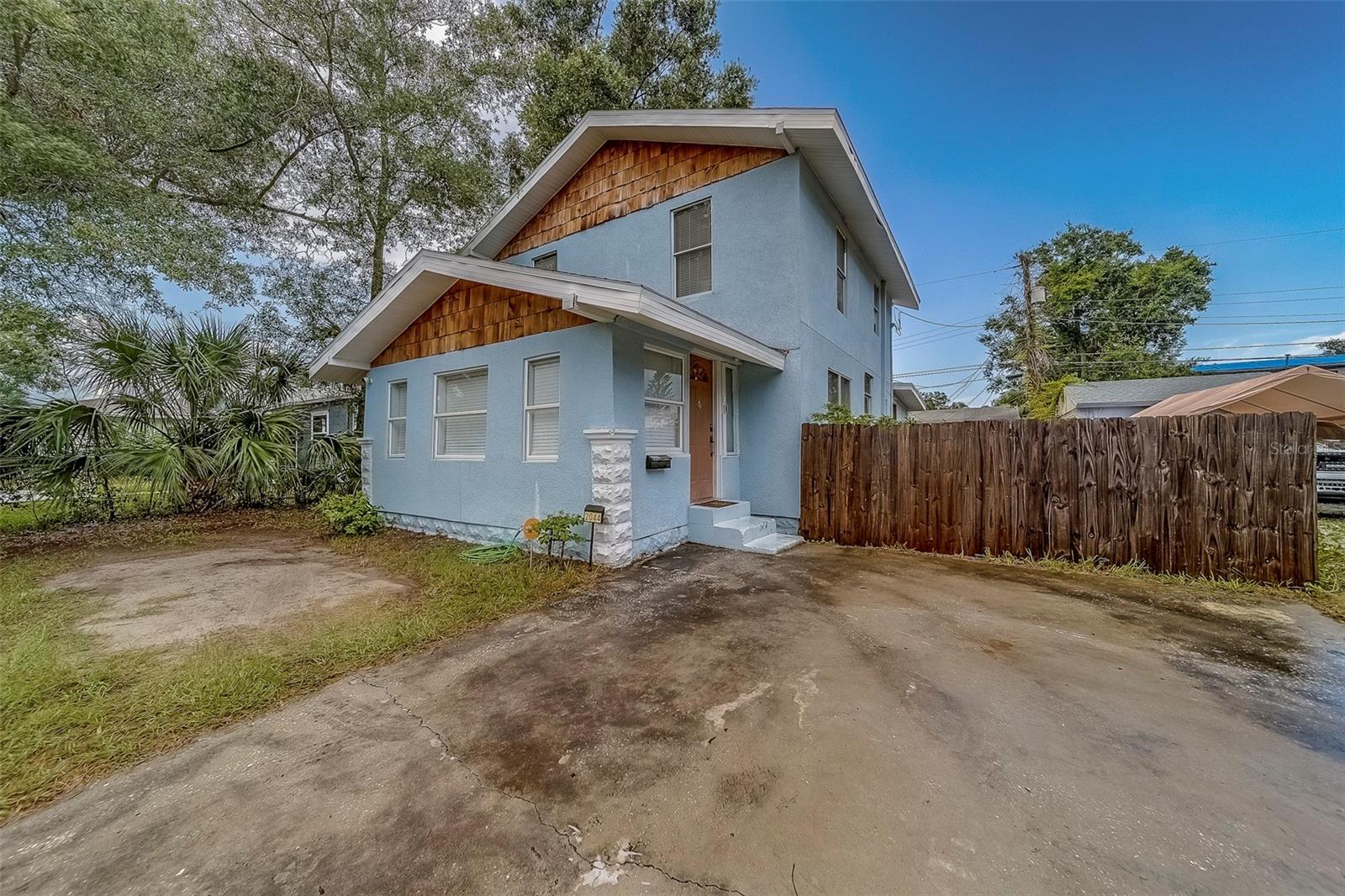 ***ASSUMABLE 3.125% VA LOAN!!! Welcome to 2044 21st Street S, fully renovated in 2020 with a newer roof (2021), water heater (2021), and AC's (2022), this home offers peace of mind and style! You'll love the fully enclosed yard perfect for relaxing or hosting family gatherings. Inside, the home shines with artistic charm, showcasing a stunning gray kitchen with mosaic tile backsplash, stainless steel appliances, solid stone countertops, and designer glass cabinet pulls. The living space boasts elegant touches including designer tile, a crystal chandelier, and modern lighting fixtures throughout. For ease, you'll enjoy, laminate and tile flooring across the entire home; every corner has been thoughtfully designed, including inside laundry, kitchen, dining, living room, bedroom, and a stylish full bathroom on the ground floor, with another full bathroom and three bedrooms upstairs. As a bonus it's located in flood zone X, requiring no flood insurance! The home is within a short distance to scenic Dell Holmes Park, only 10 minutes from Historic Downtown St. Petersburg, the vibrant Gulfport Art District, and only 15 minutes to the soft sands of St. Pete Beach! Make an appointment to see it today!