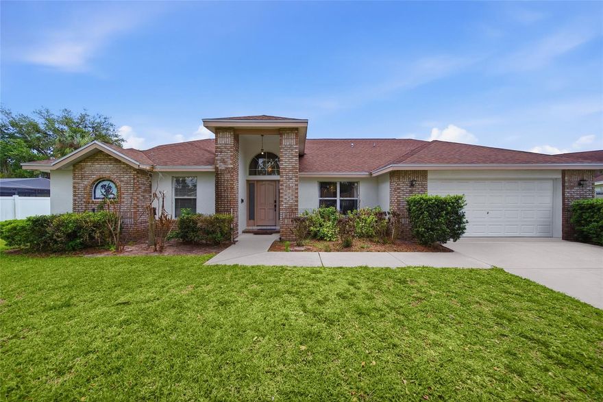Welcome to Bloomingdale! Tucked at the end of a quiet cul-de-sac, this 4-bedroom, 3-bath pool home with an in-suite bonus room delivers the kind of space, updates, and bones that make buyers stop scrolling. With a brand new roof (December 2025), A/C (2020), updated appliances (2020), pool pump (2020), sprinkler system (2020), and water heater (4 years old), the big-ticket items are already handled — so you can move in and enjoy. From the moment you step through the ornate entry, soaring ceilings and an open layout set the tone for a home that lives much larger than it looks. The kitchen is the kind of space home chefs dream about — white shaker cabinetry, dual-surface counters with a dark granite island, subway tile backsplash, professional range hood, double wall oven, and a full suite of stainless steel appliances. Whether it's Sunday brunch or a holiday feast, this kitchen handles it all without breaking a sweat.
The primary suite is in a class of its own. Vaulted ceilings, direct slider access to the pool, and a spa-inspired en suite featuring marble-look tile floors, soaking tub with subway tile surround, walk-in shower, and a double floating vanity with a stunning stained glass accent window. And then there's the bonus room — tucked privately within the suite itself, bathed in natural light, and ready to become your home office, gym, nursery, or creative escape. You simply won't find this layout anywhere else. The thoughtfully designed floor plan offers a fourth bedroom with direct bathroom access, ideal for guests, extended family, or multigenerational living.
Step outside and the fun really starts. A screened in pool is the centerpiece of a sprawling covered lanai — complete with ceiling fan and mounted TV — that's built for Florida living year-round. The fully fenced backyard offers privacy and room to roam. Additional highlights include a wood-burning fireplace in the family room, walk-in pantry, WiFi-enabled garage door opener, fresh paint (2021), and a low HOA of just $275/year!