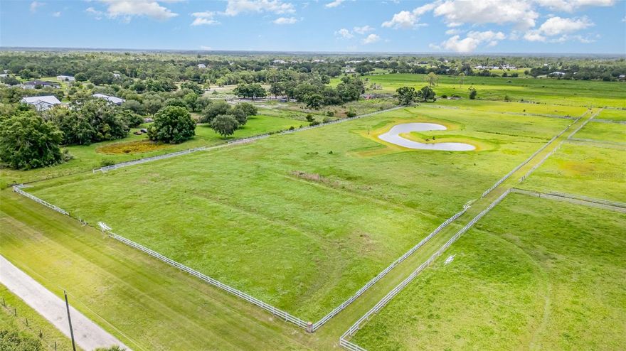 Offers 1% lender credit at closing. Discover the potential of this expansive 10-acre parcel, offering an ideal foundation for building your dreams without the constraints of CDD or HOA fees! This property has been thoughtfully prepared for you, featuring a cleared landscape adorned with lush grass perfect for grazing horses or cattle. With secure fencing and cross-fencing in place, you can easily bring your livestock right away.

Situated outside of flood zones, this location provides an excellent opportunity for your dream home, workshop, and barn. The property also boasts a beautifully positioned sparkling wetland pond that not only enhances the scenery but facilitates natural drainage as well.

This parcel presents a unique opportunity for those seeking space and tranquility, with plenty of room for RVs, recreational vehicles, cars, and more. It has a potential to divide the lot into 5 parcels and build 5 homes. Its strategic location allows for easy access to Sarasota, Bradenton, St. Pete, Tampa International Airport, and popular destinations like Lakewood Ranch, Siesta Key, Lido Beach, and Anna Maria Island. Additionally, Myakka State Park is just around the corner, offering hiking, nature trails, and horseback riding opportunities.

Don’t miss out on the chance to make this property your own. Bring your horses and schedule your showing today!