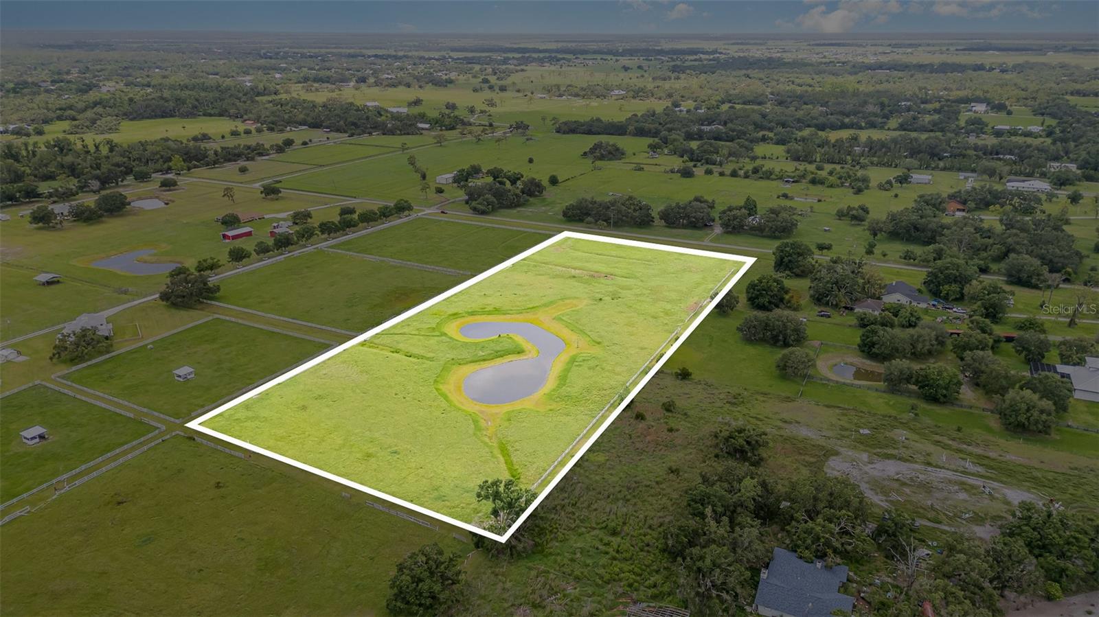 Discover the potential of this expansive 10-acre parcel, offering an ideal foundation for building your dreams without the constraints of CDD or HOA fees! This property has been thoughtfully prepared for you, featuring a cleared landscape adorned with lush grass perfect for grazing horses or cattle. With secure fencing and cross-fencing in place, you can easily bring your livestock right away.
Situated outside of flood zones, this location provides an excellent opportunity for your dream home, workshop, and barn. The property also boasts a beautifully positioned sparkling wetland pond that not only enhances the scenery but facilitates natural drainage as well.
This parcel presents a unique opportunity for those seeking space and tranquility, with plenty of room for RVs, recreational vehicles, cars, and more. It has a potential to divide the lot into 5 parcels and build 5 homes. Its strategic location allows for easy access to Sarasota, Bradenton, St. Pete, Tampa International Airport, and popular destinations like Lakewood Ranch, Siesta Key, Lido Beach, and Anna Maria Island. Additionally, Myakka State Park is just around the corner, offering hiking, nature trails, and horseback riding opportunities.
Don’t miss out on the chance to make this property your own. Bring your horses and schedule your showing today!