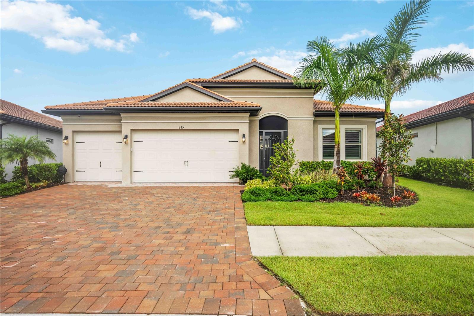 Welcome to this exquisite 3-bedroom, 5-bathroom residence spanning 2,540 square feet in the exclusive gated community of Toscana Isles. Built in 2023, this modern home blends luxury and functionality with thoughtful upgrades throughout.
Step inside to discover an open-concept layout featuring luxury vinyl plank flooring over ceramic tile, providing both durability and elegance. The gourmet kitchen is a chef's dream, equipped with premium Bosch appliances, while the adjacent laundry room boasts high-efficiency LG washer and dryer units. The living spaces are adorned with stylish Italian furniture, creating an inviting atmosphere ready for immediate enjoyment.
The primary suite offers a serene retreat with an en-suite bath, complemented by two additional bedrooms, each with private baths for ultimate comfort and privacy. A versatile den or office space adds flexibility for remote work or hobbies.
Outdoors, entertain in style on the expansive lanai, highlighted by a beautiful tongue-and-groove ceiling and a fully equipped outdoor kitchen. Relax with the premium RH outdoor furniture set, perfect for al fresco dining while overlooking the lush, maintenance-free landscaping, infinity spa (also known as a champagne spa), and numerous water features on a generous nearly 10,000-square-foot lot.
Residents of Toscana Isles enjoy resort-like amenities, including an infinity-edge pool, state-of-the-art fitness center, tennis and pickleball courts, bocce ball, a dog park, kayaking and fishing on scenic lakes, and a vibrant clubhouse with planned community events. Conveniently located near pristine beaches, shopping, and dining, this home offers the ideal Florida lifestyle.