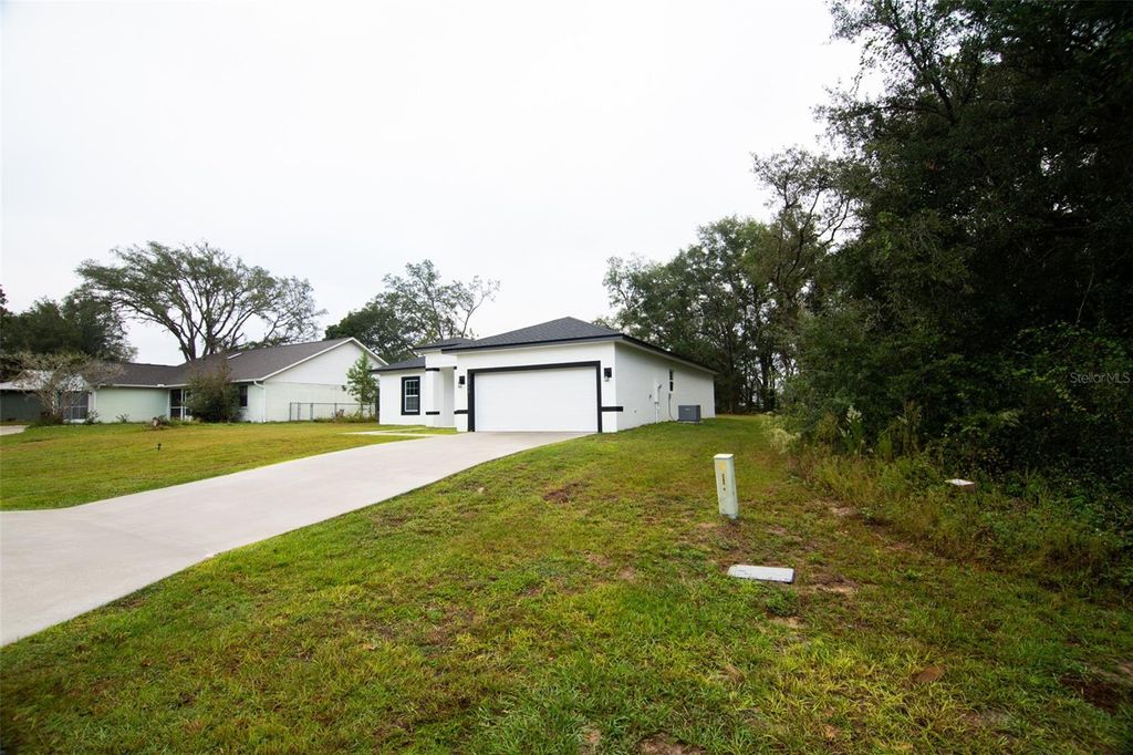 Photo of 12793 SW 43rd Circle, Ocala, FL 34473 (MLS # G5105031)