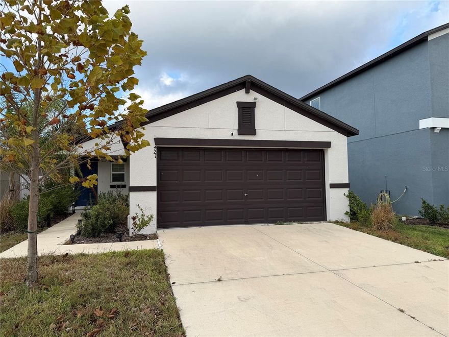 Better than new 2022 built 3 bedrooms /2 bath , 2 car garage single family home available for immediate occupancy. This single-story home features a family-friendly design with an inviting open layout "uniting the kitchen, dining room and family room" is a highly sought-after design that makes the home feel more spacious and encourages family interaction. The split bedroom plan, with the owner's suite at the back offers privacy in the back of the home complete with a full-sized bathroom and walk-in closet. At the entry are two bedrooms, perfect for siblings or a playroom. Enjoy pure, clean water throughout the entire home with the owned whole-house water purification system (not leased!)", saves money on purified water and extends the life and performance of the appliances. The community offers a low HOA fee and no CDD, keeping monthly costs affordable while providing a well-maintained neighborhood environment.The furnishings, decorations and all the home contents can be purchased separately.