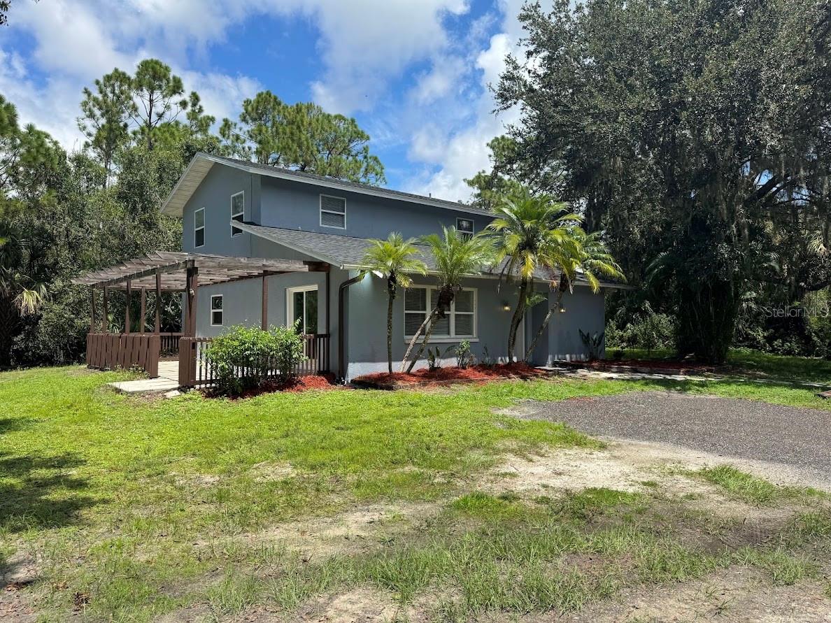 Looking for privacy and plenty of space? Welcome to this unique rental opportunity in North Port Estates, set on a sprawling 3-acre property. Inside, the first floor offers a spacious living room, a versatile bonus room perfect as an office or bedroom, a full bathroom, a convenient laundry room, and a well-equipped kitchen. Upstairs, you’ll find three comfortable bedrooms and another full bath. Step outside and enjoy the peaceful ambiance with wide-open surroundings and a tranquil pond. Lawn care and well maintenance are included in the monthly rent, saving you both time and money. Please note: there is a small secondary home on the property that is already rented. This location offers the best of both worlds; privacy and serenity, with quick access to I-75, making commutes to Sarasota, Fort Myers, and beyond a breeze.