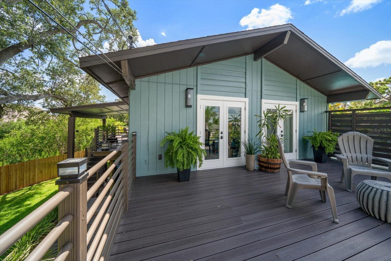 Unique Opportunity for a Tastefully Remodeled Designer-Owned Hidden Gem Tucked Away at the end of a Quiet Street in Clearwater. An Expansive Deck Surrounds the Home & not only offers Gorgeous Views, but is an Extension of the Living Area & serves as a Serene Connection with Nature. The massive garage area can accommodate 4 vehicles or serve as a space for Artists, Mechanics, Wood Shop or other Hobbies. Brazilian Cherry Hardwood Floors. Brand New Roof 2025. The Master Bedroom Opens to the Front Deck, features a Large Walk-In Closet & Stunning Bathroom with Granite Counter, Vessel Sink & Glass Enclosed Shower. This Convenient central County location is just minutes to Tampa, St Pete, Shopping, Golf Courses Dining & World Class Beaches. Those Particular Buyers who are bored with the abundance of cookie cutter homes on the market will truly appreciate this Meticulously Maintained Custom Stilt Home.