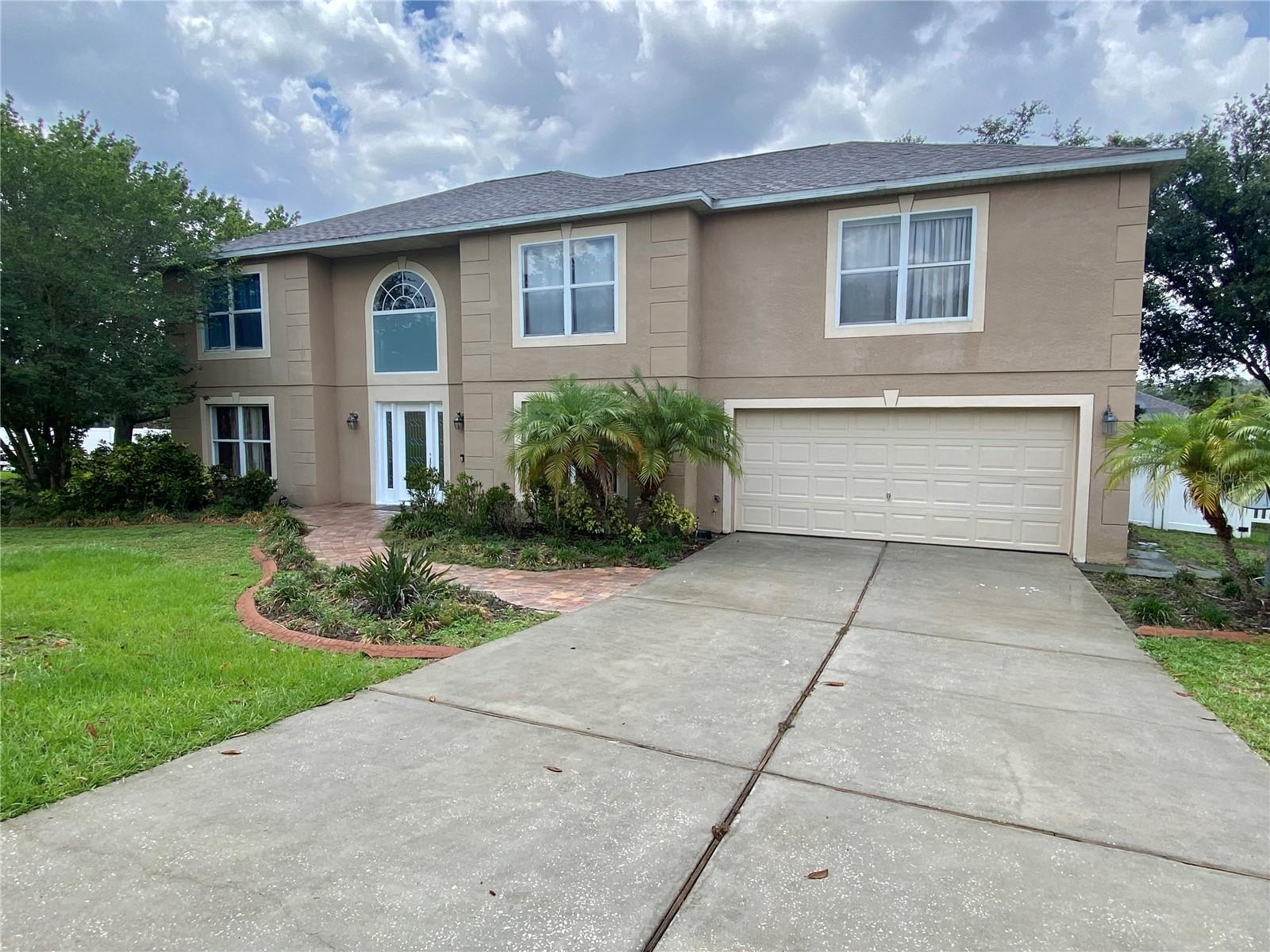 AVAILABLE 09/08/2025. This spacious 4 bedroom and 2. 5 bathroom home is located in desirable Clermont, FL. The home is conveniently located, just minutes from shopping, restaurants, schools, and major highways. The home sits on a corner lot and is just over 3000 square fee of living space. The home features an elegant entry way with a beautiful curved staircase and chandelier. The formal living room and dining room are on either side of the entry and is a perfect layout for entertaining such as a formal dinner party or event. At the back of the home is the kitchen that opens to the oversized family room. There is a large screen enclosed patio and large back yard. Upstairs is a large open loft area, great for a game room or gym. The large main bedroom features a private bath with soaking tub and stand alone shower, along with two separate closets. The other three bedrooms are on the other side of the home. There is a large two car garage. Washer and dryer is included, but maintained by the tenant. Lawn cutting is the responsibility of the tenant. One small dog will be considered with pet fees and no smoking inside or outside on the premises.