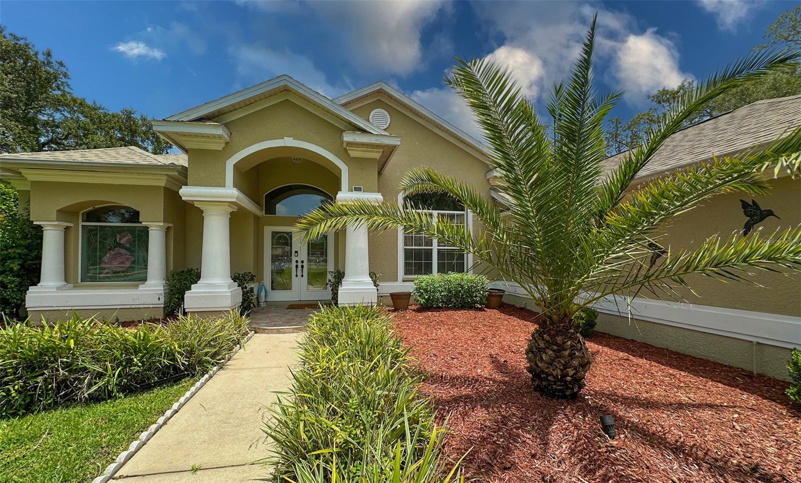 Absolutely stunning pool home in Autumn Oaks community. On cue-de-sack. Wooded lot. Mature landscaping. Open floor plan. Updated kitchen. Granite counter tops. Stone fireplace. 4 car garage. Man cave, that could be merged with garage #4 to make an in-law apartment or a guest room with full privacy. New roof and water heater 4 years ago. Beautifully maintained. High ceilings. Crown molding. It's a showcase home. A Must see. Make an appointment to see it and in may become a place you'll call home. Enjoy Florida living at its best. Only few miles from Gulf of America and yet a NO FLOOD zone. Close to all major roads. Golf courses, shopping and restaurants.