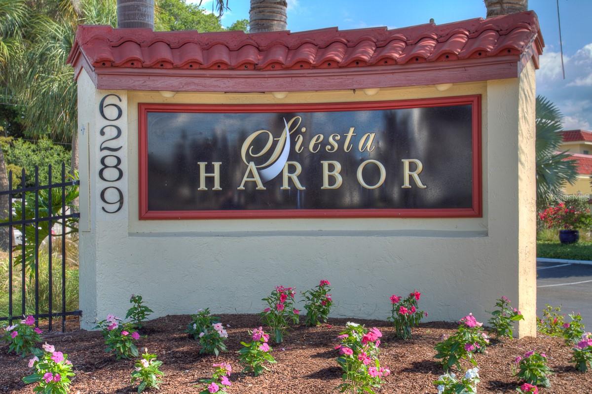 This 2 bedroom, 2 bath condo in this popular 55+ community, is conveniently located on the ground floor next to the club house and swimming pool, and features new appliances, granite counter tops and ceramic flooring.
Queen size bed in the Master with a walk in closet plus a full wall length closet. The guest bedroom has 2 single beds that can be combined to make a King. Updated bathrooms include a guest bath with a tub/shower combination.
The complex is surrounded by the Intracoastal Waterway with boat access to the Bay. Boat slips can be rented for a nominal fee. Enjoy your morning coffee on the large Lanai overlooking the boats in the Harbor. There is 1 assigned carport and ample visitor parking.
Siesta Harbor has a large saltwater heated pool, spa, fitness center, outside grills and tables, shuffle board courts, boat docks, fishing pier, a large community room with kitchen facilities for parties and a small lending library and pool table to occupy your time on that rare non-sunshine day.
Across the street is Crescent Beach (Siesta Beach) rated #1 beach in America with deeded beach access for Siesta Harbor guests.
Put your toes in the fine quartz sand that stays cool on your feet as you walk along the Gulf of Mexico shoreline. Siesta Key Trolley offers free rides to Turtle Beach or Siesta Village. Siesta Harbor is an over 55 community. No pets allowed. High season rates in effect December through April.