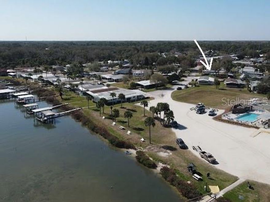 Welcome to the most desirable location of Terra Mar Village! NO LAND LEASE FEE! This amazing property is situated in a large corner parcel of 5,275 sqft., with no home on the left or behind offering a peaceful, open feel that’s rare in the community. This spacious property comfortably features an open-concept design with a cozy fireplace in the recreational living room and covers porch with large windows throughout to make the most of the riverfront setting with an outdoor deck for a viewing wildlife. Enjoy your Florida river house with a private boat ramp that offers the ultimate stress-free aquatic lifestyle and avoid busy boat launch crowds and long, inconvenient waits. This well-maintained property offers a perfect blend of comfort and style. Featuring a HVAC system installed in February 2026. Water Heater is only 5 years. Windows and roofs were replaced a few years ago. Completely furnished, including ALMOST NEW washer/dryer. Please see the attached "Off Limits." The gourmet kitchen features a large island with breakfast bar seating. Beautiful custom entertainment centers in the family and living rooms provide an elegant and unique environment. The primary bedroom features a large en-suite with a step-in shower, and the guest bathroom has a bathtub/shower combo. Convenient Indoor Laundry Area. The outdoor shed adds the ease of having extra storage space. 2 Carports provide accommodation for 3-4 cars. LOW MAINTENANCE FEE OF ONLY $265/MONTH. This house is truly move-in ready and just a short drive to our crystal sand beaches of New Smyrna Beach and magnificent Flagler Beach with exotic boutiques and restaurants, the marina, local golf courses, shopping, variety of restaurants, the museums and Doctors hospitals.  Living in this beautiful house, you will come to realize how extraordinary it is to have it all for a reasonable price. Reward yourself with this panoramic scene that will fill you with peace and joy! Don't let it go!