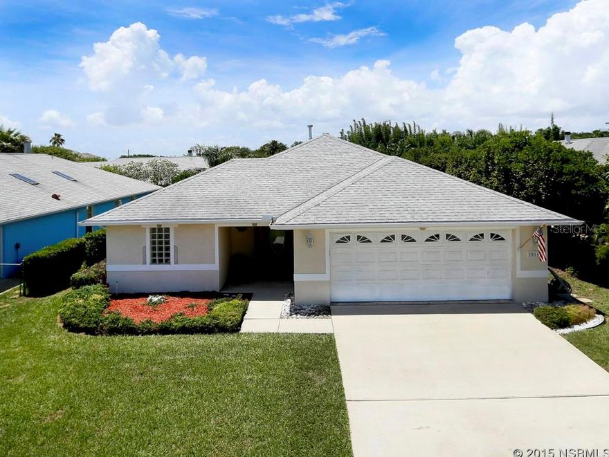 Welcome home to the quieter side of New Smyrna Beach, where the atmosphere is pure relaxation inside and out. Built in 2001, this contemporary 3 bedroom, 3 bath oasis is just a short stroll from one of New Smyrna's prettiest stretches of beach, close enough to hear the surf from your front door. The manicured lawn invites you to enter an airy, sun-splashed interior with an impressively open floor plan, bathed in natural light through plantation shutters and twin skylights in vaulted ceilings. In the roomy kitchen you'll find enough cabinetry and counter space for even the most passionate foodies. The great room â one that lives up to its name â features a wood-burning fireplace and the perfect layout for entertainment. The spacious master bedroom easily accommodates a king-sized bedroom set while the en-suite bathroom, with a double vanity, stand-up shower and separate jetted tub, befits the king and queen of the house. All three bedrooms feature full baths with elbow room. Along with a natural gas water heater, the kitchen, fireplace and patio are all gas-ready. And you're ready, too. Ready to watch sunsets over the river from a secluded neighborhood dock located around the corner. Ready to walk the dog to nearby Smyrna Dunes Park and hit the renowned shops & eateries of Flagler Avenue, just minutes away. You're more than ready to live the good life in New Smyrna Beach. All information intended to be accurate but not guaranteed. ;Water: City