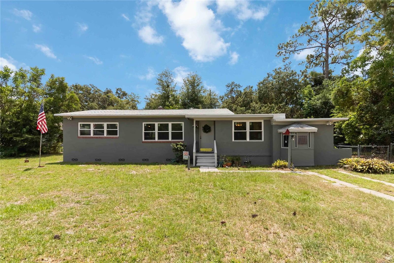 One or more photo(s) has been virtually staged. Check out this versatile 3 bedroom/3 bathroom home in Sanford. This home is full of charm and ready for new owners! Featuring a newer roof (2023) and two bonus rooms, this home offers plenty of space for a home office, hobby room, or extra living areas. The kitchen is a true highlight with beautiful butcher block countertops, newer appliances, and motion-detection lighting. The living room features a custom built-in wooden bookcase, adding both character and function. Step out to the screened-in porch—perfect for relaxing or entertaining—and enjoy the fenced backyard with an electricity-equipped shed, irrigation pump, and some working sprinklers to help keep your yard green. This home is located near schools, the Sanford-Orlando Airport, major highways, public transportation, shopping, and the vibrant Sanford Historic Downtown District, full of popular restaurants and entertainment. You’re also just minutes from Lake Monroe’s scenic waterfront trail and within easy reach of local attractions and beaches. Don’t miss your chance to own this spacious and well-located home—schedule your private tour today!