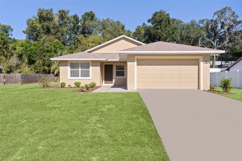 Photo of 323 W Lady Lake Boulevard, Lady Lake, FL 32159 (MLS # G5104421)