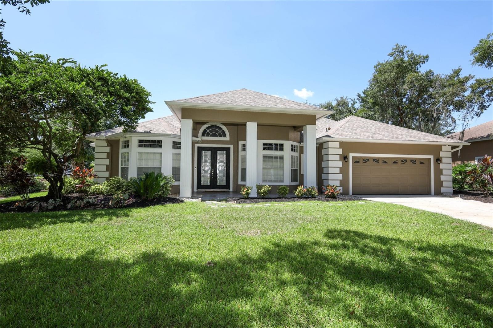 Gorgeous 4-bedroom 3-bathroom pool home in the desirable Oviedo community of Kingsbridge West! This amazing home is nestled on a tranquil and quiet tree-lined street, has tons of recent upgrades including luxury vinyl plank flooring in the kitchen and living area, fully remodeled master bathroom, kitchen revamped with back splash, lighting and stainless appliances, pool resurface and new tile, summer kitchen for grilling, beautiful travertine on the pool deck and covered patio, pool cage repainted, septic drain field replaced and new carpet last week! The flexible open floor plan and outside private oasis allows for both entertaining and everyday living. This home is move in ready and checks all the boxes! Kingsbridge West offers resort style amenities including lighted tennis courts, playground and fishing pier on 120 acre long lake stocked with bass and blue gill! Don't miss out on the opportunity to own this magnificent Oviedo pool home! Schedule your private tour today!