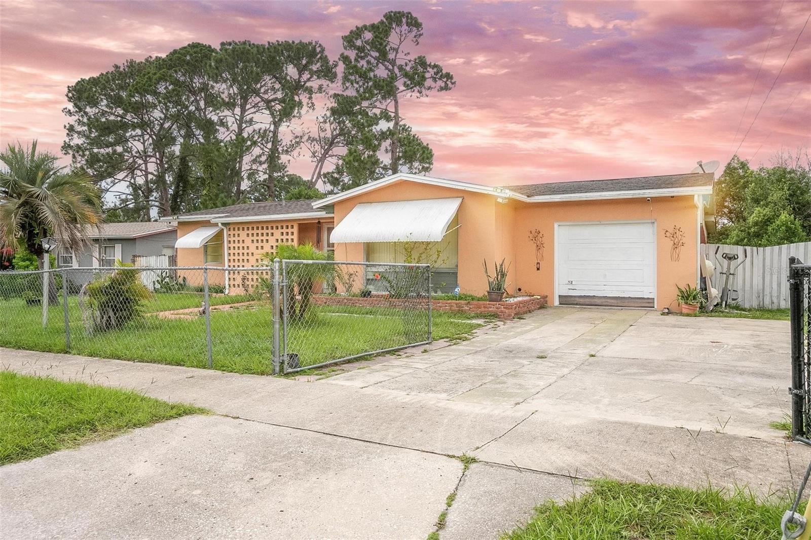 Under contract-accepting backup offers. Welcome to this charming Deltona home perfectly suited for both seasoned investors and first-time homebuyers looking for their dream starter home. Step inside this cozy abode to discover three well-appointed bedrooms, providing ample space for a small family, roommates, or even as a potential rental property. The natural light that floods the rooms creates an inviting and warm ambiance, making you feel right at home from the moment you walk in.
The two bathrooms boast contemporary finishes, ensuring a comfortable and refreshing experience for all residents and guests.
One of the standout features of this property is the absence of HOA fees, providing you with the freedom to personalize your space without restrictions. The private, fenced-in backyard adds an extra layer of privacy and security, making it an ideal spot for kids to play or pets to roam freely.
For those seeking additional storage space or a workshop, a convenient storage shed awaits in the backyard. This feature is perfect for storing gardening tools, outdoor equipment, or any other belongings you might need close at hand.
Whether you enjoy relaxing under the stars or hosting gatherings, the screened patio offers a versatile space that can be utilized throughout the year. It's an idyllic spot for savoring morning coffee, dining al fresco, or simply unwinding after a long day.
Situated in a well-established and sought-after area, you'll find this home conveniently located near schools, parks, shopping centers, and major transportation routes, enhancing its appeal to both potential tenants and future buyers.
Don't miss this fantastic opportunity to invest in a property with great potential or to embark on your homeownership journey with all the essentials and comforts you desire. Arrange a viewing today!!