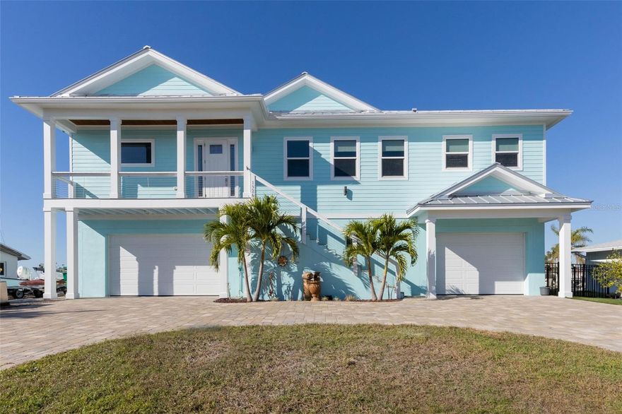 Turn key furnished!!!! Fall in love again! This masterfully designed custom built home offers all the opportunities to fall in love with the beauty of the Lemon Bay estuary. Serenity is found within the multilevel outdoor spaces as you enjoy viewing manatee, dolphins, numerous varieties of fish and scores of beautiful birds in your backyard oasis! Launch your waterfront lifestyle with ease from the two existing boat lifts, kayak launch, additional docking for a larger vessel is also already in place! Fish the backwaters of the bay or quickly head out to the Gulf waters for an offshore adventure, this location is only a few short minutes from Stump Pass and puts you in the Gulf in the blink of an eye! Bring back the days catch and utilize the highly customized cleaning station! The coastal inspired architecture of the home gives way to a complimentary interior with open and bright living spaces.  The Chefs Kitchen is highlighted by a large propane range, pot filler and beautiful range hood! Other kitchen highlights include premium grade convection oven/convection micro combo and convenient built in steamer for healthy options. The master suite is everything you'd expect with bay views complimented by luxurious amenities such as his/her walk in closets, dual vanity, generous jetted soaking tub, and massive shower including two shower stations. Three secondary bedrooms and two secondary baths are sure to make your guests feel right at home! Elevator access between floors adds additional convenience! The living area outdoor deck is perfect for entertaining with its beautiful outdoor kitchen, generous space and amazing views. Lounging around the pool decks, you'll find relief in shaded areas or bask in the sun on the pool sunshelf, the elevated spa is the perfect spot to relax after a day on the water and take in an amazing sunset. Your road worthy toys will also love their new home within the massive garage with all kinds of room for multiple vehicles and storage! This home is storm ready with Impact windows/doors and a long lasting steel roof! Properties like this one don't come along every day, don't let this one slip away.