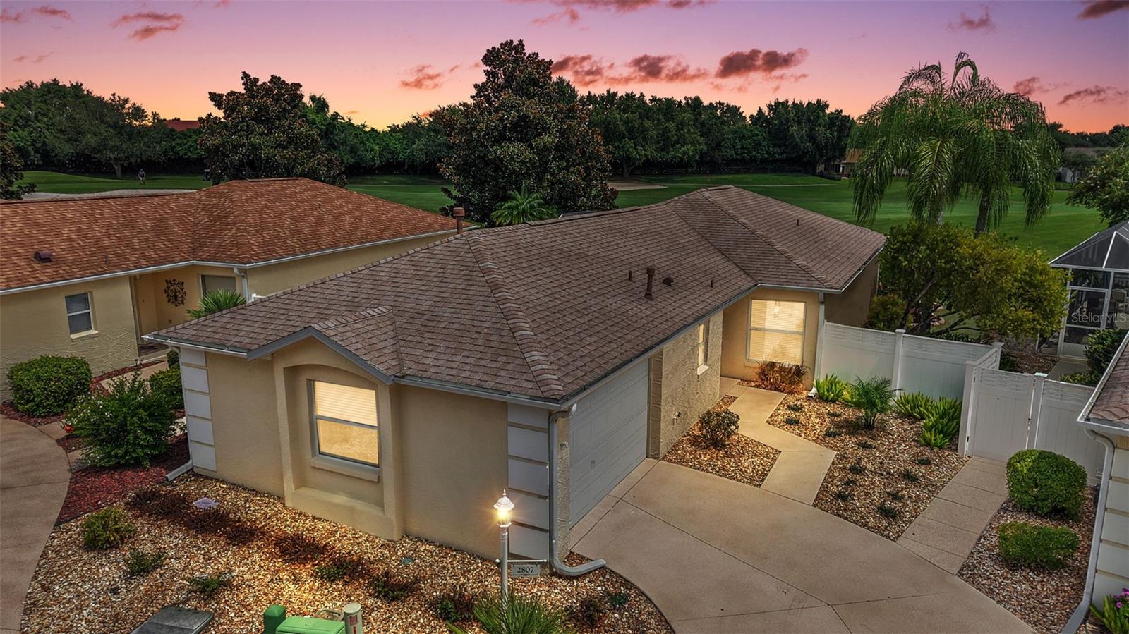 TURNKEY 3/2 FOXGLOVE COURTYARD VILLA with GOLF FRONT VIEWS, SWIM SPA, and RECENT UPDATES in the desirable VILLAGE OF BELVEDERE! Welcome to this beautifully appointed villa offering the perfect blend of comfort, convenience, and lifestyle. Whether you’re looking for a full-time residence, seasonal retreat, or investment property, this home is truly move-in ready with thoughtful updates throughout. Step inside to an open-concept living area with vaulted ceilings, luxury vinyl plank flooring (2023), and seamless flow between the kitchen, dining, and living spaces—ideal for entertaining. The kitchen features a spacious breakfast bar, pantry, and plenty of counter space, making both cooking and gathering a pleasure. The private primary suite offers vaulted ceilings, a walk-in closet, and an en-suite bathroom with a walk-in shower. Sliding doors provide direct access to the lanai, creating a peaceful retreat. A centrally located guest suite features its own bath and sliding door for added privacy, while the versatile third bedroom works perfectly as a guest room, home office, or cozy den. One of the highlights of this home is the freshly painted oversized screened lanai overlooking the golf course, complete with an inground swim spa and new pumps (2024). It’s the perfect spot to relax, recharge, and enjoy the Florida sunshine with no rear neighbors! Additional features include an indoor laundry room with wash basin, low-maintenance Florida gravel landscaping, a NEW ROOF (2021), and HVAC system (2020). Located in the highly sought-after Village of Belvedere, this home is ideally situated for convenience and entertainment. About 0.8 mi to the Belvedere Neighborhood Pool and Rec Center, 3 mi to Lake Sumter Landing Town Square, and under 1 mi to the bustling 466 corridor, where you'll find over 18 restaurants, 3+ grocery stores, PetSmart, Hobby Lobby, doctor offices, gas stations, banks, and the highly anticipated Costco opening in 2025. This home is also golf-cart accessible to numerous pools, the POLO FIELDS and the Savannah Regional Recreation Center. SURROUNDED BY GOLF, PICKLEBALL, AND COUNTLESS RECREATION OPTIONS. Schedule a visit today and start living your best life in this vibrant, amenity-rich neighborhood. Don’t miss the walkthrough video of this stunning golf-front villa! Call today to schedule your private showing or virtual tour.