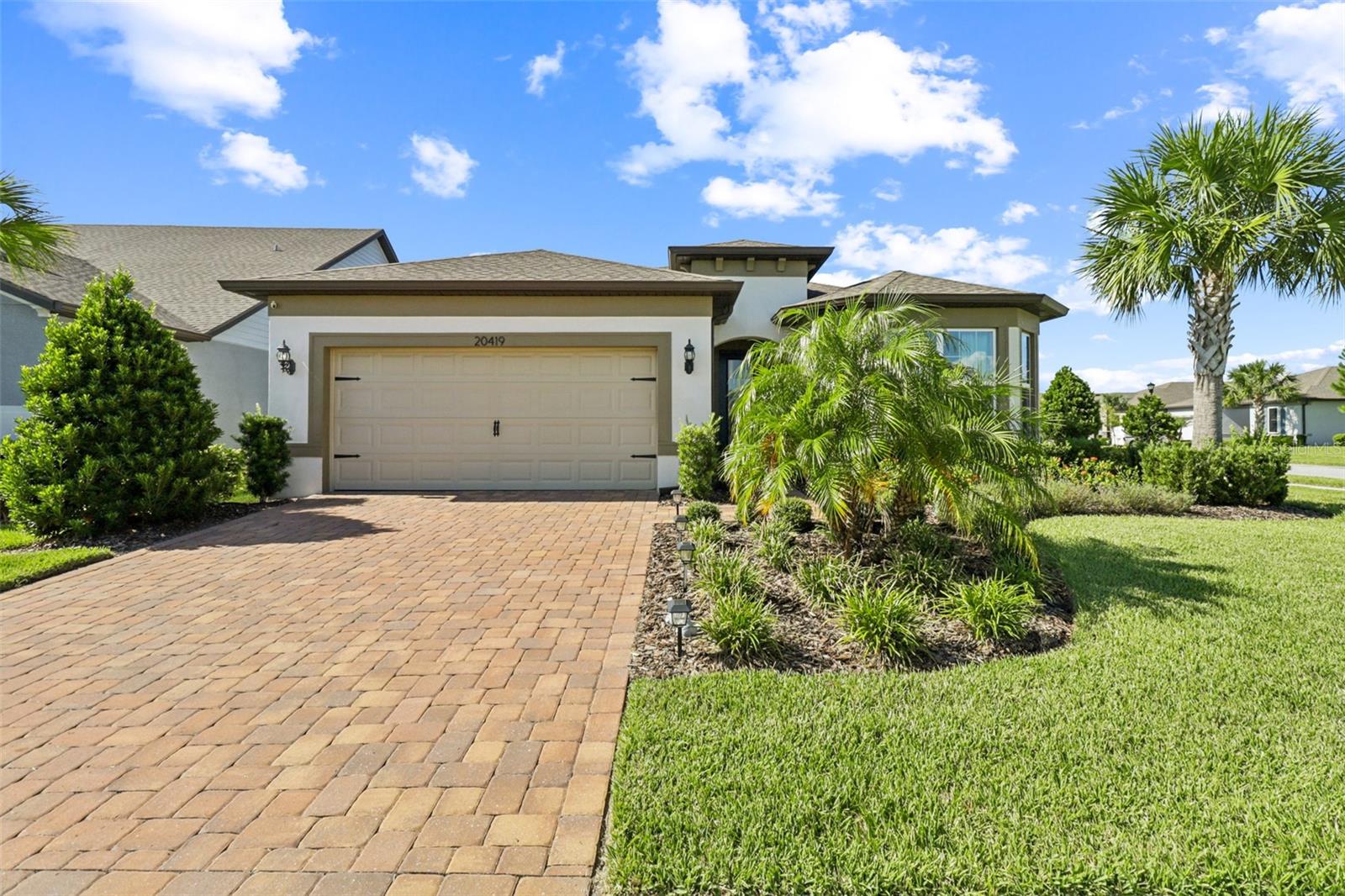 Welcome to Del Webb Bexley – Premier 55+ Living! This beautifully maintained 2-bedroom, 2-bath home with 1,916 sq ft of living space offers the perfect blend of comfort and convenience. Built in 2021, all major systems are just 4 years old! The spacious layout features a generously sized primary suite with a walk-in shower, walk-in closet, and ample natural light. A large flex room/office with elegant French doors provides versatility for work or relaxation. Enjoy Florida living on the extended screened-in patio, where you can unwind with serene lake views. The low-maintenance lifestyle includes landscaping covered by the HOA, so you can spend more time enjoying everything this active community has to offer. Del Webb Bexley features a resort-style amenities center with a state-of-the-art gym, dog park, activities and events, and even a full-service bar for socializing and entertainment. This is the one you’ve been waiting for – schedule your private showing today!