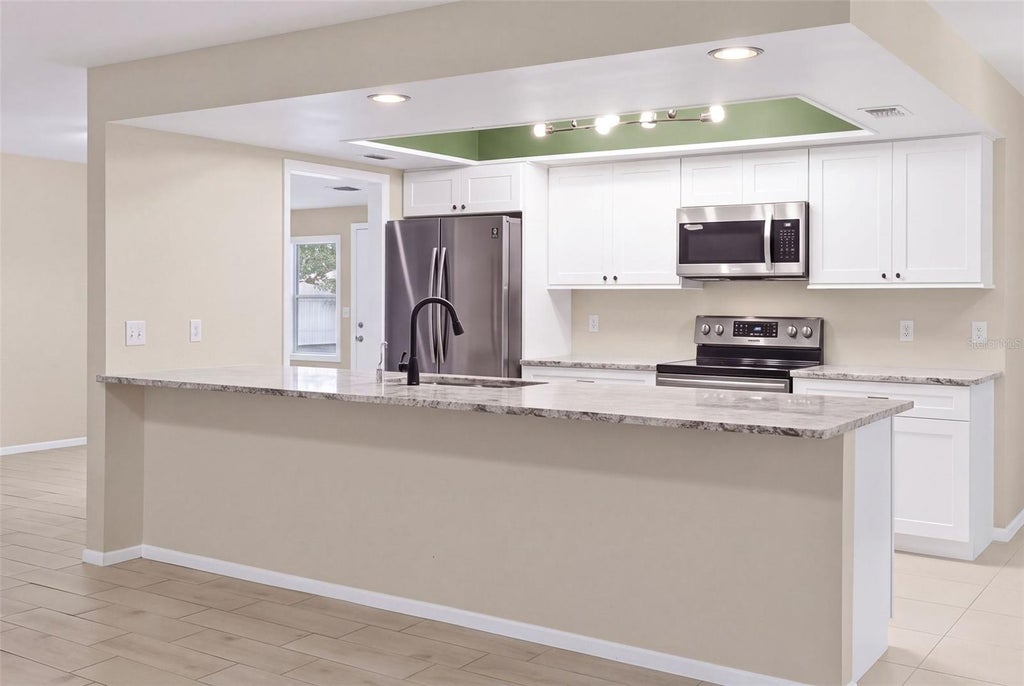Photo of 998 Dumont Drive, Dunedin, FL 34698 (MLS # TB8557666)