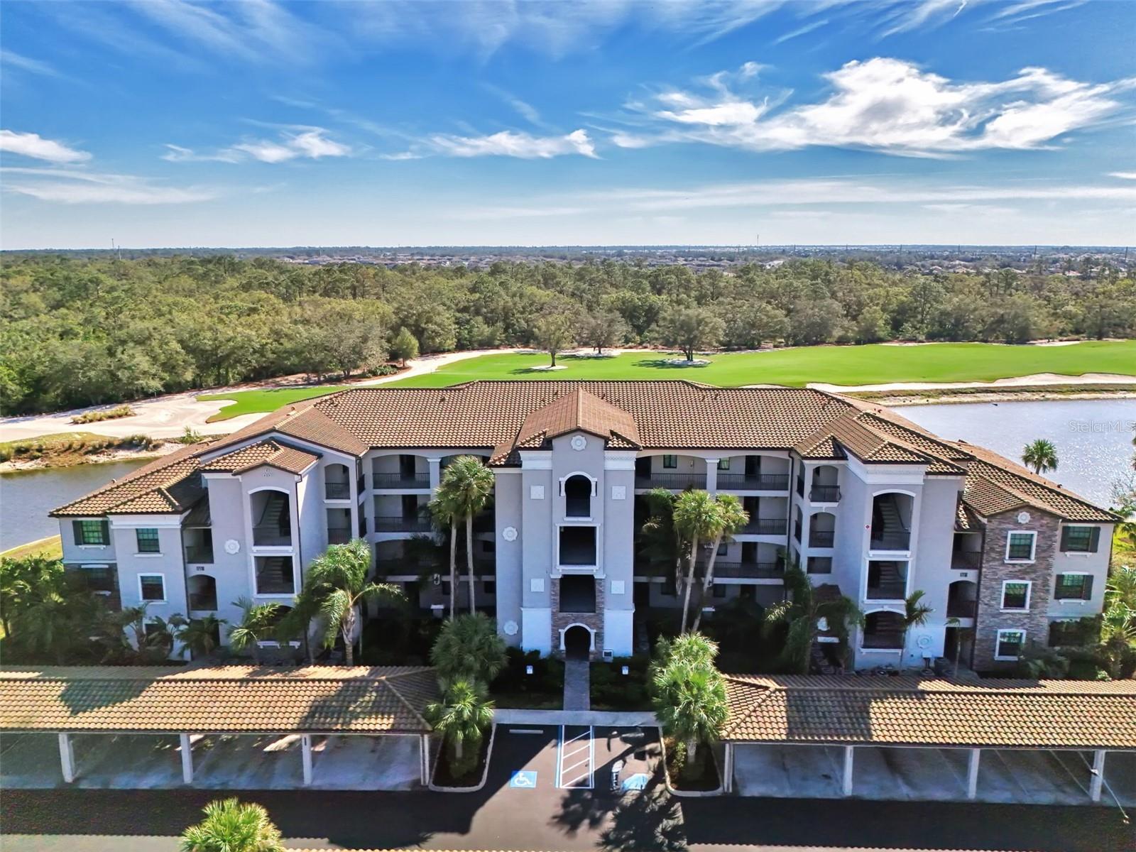 Price REDUCED– Don’t Miss This Opportunity!
Experience resort-style living in the heart of Lakewood Ranch National Golf & Country Club. This beautifully furnished, TURNKEY 2-bedroom, 2-bath Birkdale model is a highly sought-after end-unit on the second floor, offering panoramic views of the 11th hole on Commander’s Course, tranquil ponds, and protected nature preserves – all visible from the spacious screened lanai where you can unwind with breathtaking sunsets.
The open-concept layout features a chef’s kitchen with a large island, granite countertops, stainless steel appliances, and upgraded custom pull-out pantry drawers. The split-bedroom floorplan provides privacy, with a spacious primary suite offering walk-in closets and a walk-in shower. Guests will appreciate their own comfortable room and adjacent full bath. Additional conveniences include in-unit laundry, a covered parking space, and a private storage unit for bikes or gear.
Ideal for seasonal or year-round living, or an attractive investment property with 12-monthly rental potential per year. Lakewood National is a 24/7 guard-gated, maintenance-free community offering two Arnold Palmer-designed championship golf courses, a grand clubhouse, full-service spa, fine and casual dining, a cocktail bar, resort-style pool with lap lanes, tennis, pickleball, bocce, and a state-of-the-art fitness center with group classes. Residents also enjoy men’s and women’s lounges with locker rooms, on-site event space, and a full-time activities director.
Live where luxury meets lifestyle—schedule your showing today!
