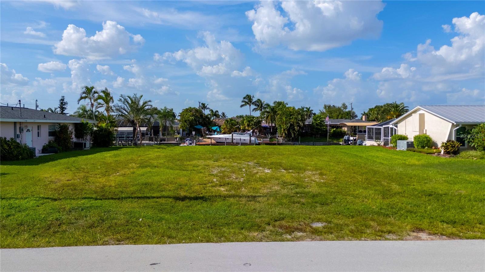 This beautiful waterfront, DIRECT ACCESS property is conveniently located close to shopping, restaurants and surrounded by beautiful waterfront properties!! With a 2019 SEAWALL already in place, it's ready for you to build your dream home and enjoy Cape Coral to the fullest!!