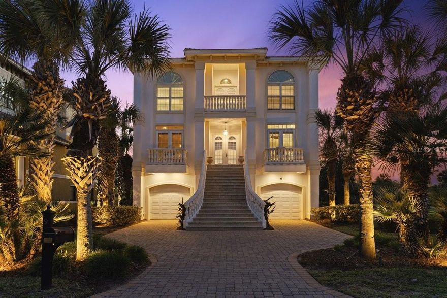 Discover unparalleled luxury in this spectacular coastal estate pool home, situated on a quiet cul-de-sac along the renowned Jack Nicklaus Signature Ocean Course in the luxurious, gated oceanfront community of Ocean Hammock. Furniture Conveys!!!

Spanning nearly 5,000 square feet of elegant living space across three levels — plus expansive outdoor entertaining areas — this custom estate offers abundant room for family, guests, and effortless coastal living.

Pass through the security-gated entrance and follow the scenic, oak-lined street with its manicured lawns and impressive custom homes. Your paver driveway leads to a striking facade featuring a grand staircase, oversized arched transom French doors with balconies, stepped barrel-tile rooflines, and dual oversized garages with storage.

The ground level is ideal for guests or multigenerational living, with two plush en-suite guest suites, a vibrant guest living area complete with bar and kitchenette, and direct access to the stunning lagoon-blue pool, attached spa, upgraded paver deck, and covered lanai. A convenient pool bath makes poolside days effortless. Relax, unwind, and soak in the year-round Florida sunshine in your private outdoor oasis.

Ascend to the second floor, where the bright foyer makes an immediate and lasting impression.To the right, a formal sitting room with private balcony; to the left, a handsome study with en-suite bath and closet — easily convertible to a third guest bedroom or home office. Straight ahead lies the heart of the home: an open-concept gourmet kitchen, dining area, and spacious living room designed for effortless entertaining.

The chef’s kitchen shines with timeless white cabinets, stainless steel appliances, gas range, granite countertops, crisp white tile backsplash, and a curved island with bar seating. Natural light floods the space, and double French doors open to a generous balcony overlooking the world-famous Jack Nicklaus Ocean Course. A spiral staircase provides convenient access from the balcony down to the pool area.

The living room impresses with a wet bar featuring granite counters and wine fridge, a cozy gas fireplace, surround-sound ceiling speakers, and custom built-in cabinetry — perfect for displaying art and family memories. Fresh paint, impressive 24-inch tile flooring, plantation shutters, and elegant crown molding flow throughout. Electric hurricane shutters offer peace of mind and protection.

The third floor features soaring 12-foot ceilings and two luxurious suites, highlighted by the exquisite primary suite with his-and-hers vanities, his-and-hers walk-in closets, and a spa-like walk-in tiled shower. A large laundry room is conveniently located on this level.

An elevator ensures seamless movement between all three floors, adding effortless luxury to daily living.

Just a short walk to the beach and Hammock Beach Resort amenities, you’ll enjoy world-class golf on the Jack Nicklaus Ocean Course, multiple pools (including a multi-level pavilion with lazy river), spa, fitness center, tennis and pickleball, fine and casual dining, and a vibrant calendar of social events — all right at your doorstep.

This is coastal Florida living at its absolute finest — private, luxurious, and perfectly positioned.

Don’t miss this rare opportunity. Schedule your private tour today and make 9 Northshore Drive your new home!