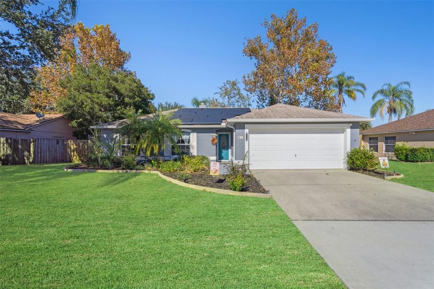 Welcome to a well-kept, thoughtfully designed 3 bedroom, 2 bathroom home offering peaceful views, dependable energy costs, and inviting indoor–outdoor living. Large windows in the living room, kitchen, and breakfast nook overlook the home’s meticulously maintained backyard, creating a calm, natural backdrop throughout the day. A cozy fireplace adds warmth and charm to the main living space.

The property features a leased solar system that provides a consistent electric bill of $183.50/month, giving future owners the option of reliable utility costs and long-term financial efficiency.

Step outside to a backyard built for Florida living, complete with a screened patio, fire-pit area, and beautifully manicured lawn — ideal for morning coffee, evening relaxation, or weekend gatherings.

For buyers looking to establish residency, there is still time to finalize a purchase before the end of the year, allowing the new owner to qualify for homestead exemption.

This home offers comfort, predictability, and pride of ownership in a quiet Deltona setting. **Roof 2019, Water Heater 2019, AC 2010-maintained every 6 months**