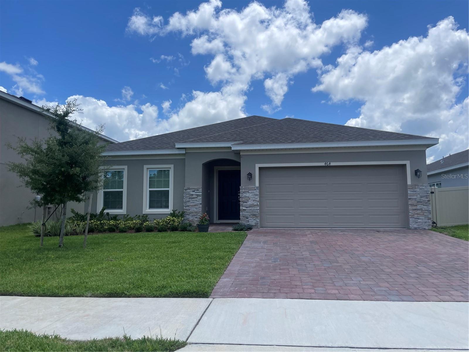This is a Mt Dora area property in new community of Lake Lincoln. A very popular new home, the Selby Flex plan offering an open-concept design with split bedroom layout includes 4 Bedrooms, 2 full Baths, and 2 car attached Garage. Tile floors are featured throughout the main living areas of the home. Kitchen includes upgraded 42" cabinets with crown molding, quartz countertops, recessed lighting, and stainless appliances. This home is like brand new a great option. A large Family Room overlooks rear covered private Lanai - The Primary bath features new extra high vanity with quartz countertops and dual sinks, walk-in closet, and glass shower enclosure. Exterior includes brick paver driveway and lead walk, partially fenced back yard. Lake Lincoln Community amenities include a small dog park, walking trail, and a playground/tot lot with plenty of shade for the littlies under a cluster of shady oak trees. Lawn Service and Pest Control are included in rent!!!! Washer/Dryer hookups. Refrigerator will be different than what is shown in the property. Conveniently located close to schools, Publix shopping center, Target, and Walmart. Minutes to the quaint downtown areas of Mount Dora & Eustis, with easy access to major thoroughfares.