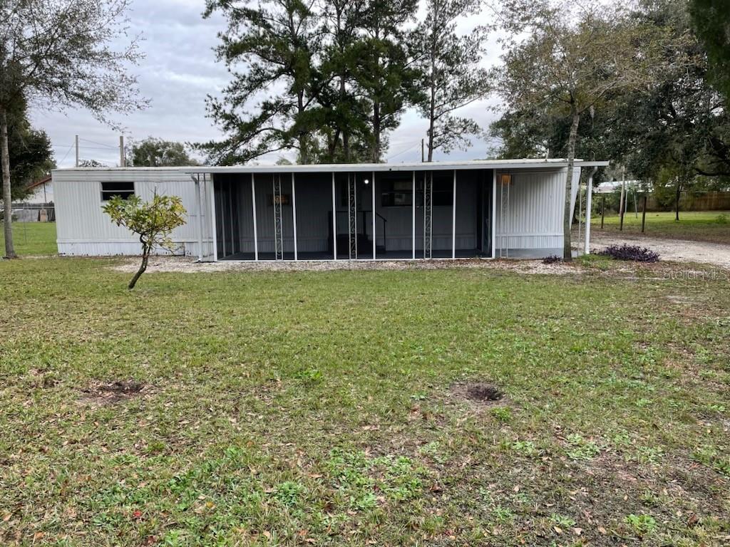 Seller will hold mortgage with 30% down! 2025 AC. Home has already been inspected and repairs are being done. Great starter home or retirement home on an oversized waterfront lot with it's own private boat ramp! Recently remodeled with new kitchen cabinets and fresh LVP flooring. Seller will install stove and fridge before closing. Beautiful water view down the length of the canal, leading out to great fishing and water sports on the lake. Carport plus screened in front porch and back porch.