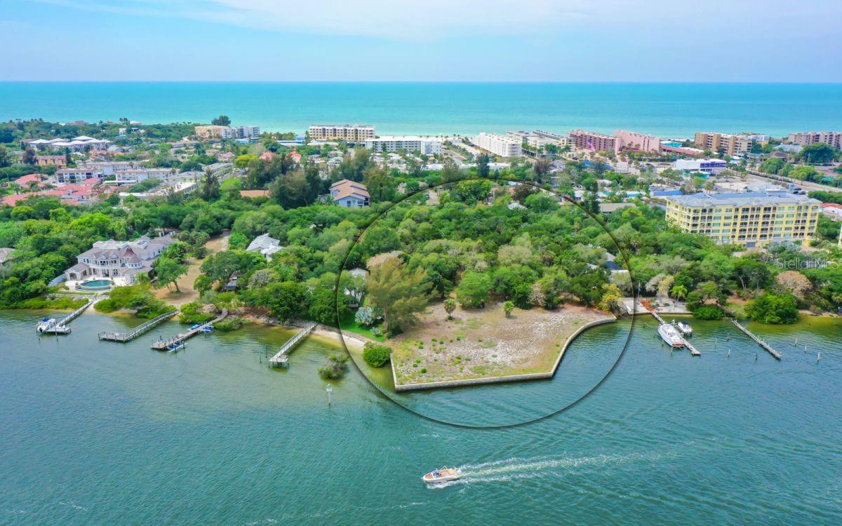 Property is two parcels totaling 2.86+/- acres. Direct Intracoastal Waterway frontage. Build a large estate/compound or possibly divide into 2 parcels. This south Siesta Key location puts you close to restaurants, shopping and it's only 3 blocks to the beach. All offers are subject to board approval.