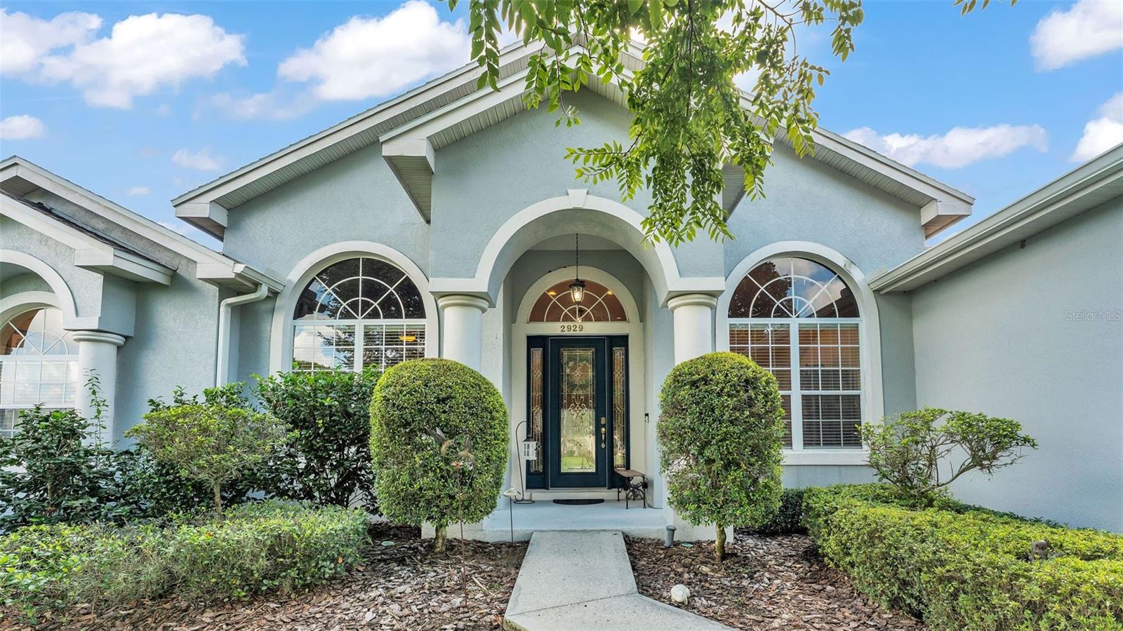 Welcome to Vintage View, a beautiful executive neighborhood in the Highlands part of South Lakeland. This is a gated community in one of the most desired school districts in the area(Valley View Elementary and George Jenkins High School). It is located within minutes of the Polk Parkway for easy communing to Tampa and Orlando. This home, built by Cassidy homes is exquisite! Featuring 4 true bedrooms and 2 and half bathrooms, it truly has the perfect layout. Offering room to spread out but that open concept feel to enjoy gathering. This home has 10 and 12ft ceilings throughout, crown molding in the main living areas, insanely gorgeous engineered hardwood flooring, 4 and a quarter inch baseboards, recessed lighting, beautiful archway details, and lots of windows for perfect daytime lighting. The entire yard has been professionally landscaped and the back yard has cute picket fencing. This home faces west so the back screened porch is shady in the afternoon allowing for a place to relax and reflect on the day. The kitchen is in the heart of this home. Corian counter tops, solid wood cabinets and Kitchen Aid and Samsung appliances complete this space for functionality and design. It also offers a breakfast bar and a walk in corner pantry. The inside laundry room just off the kitchen and garage offers good space and a mud sink. The primary bedroom is large and beautiful. It has access to the back porch, double walk in closets and a private luxury en-suite with separate commode room, dual vanities and a garden tub. The 4th bedroom is currently being used as an office and it features double french doors and a closet. The 2nd and 3rd bedrooms are on the opposite side of the home and share a larger guest bath. The half bath has access to the back porch. The large and inviting family room and formal living and dining rooms complete the home. The owner has taken great care of this home with yearly service of both the HVAC (2018) and septic systems as well as consistent pest control service. The roof is original and time for a replacement, the owner will consider replacing the roof with an acceptable offer. Pride of ownership will be noticed here so contact your agent and come and see this home today!