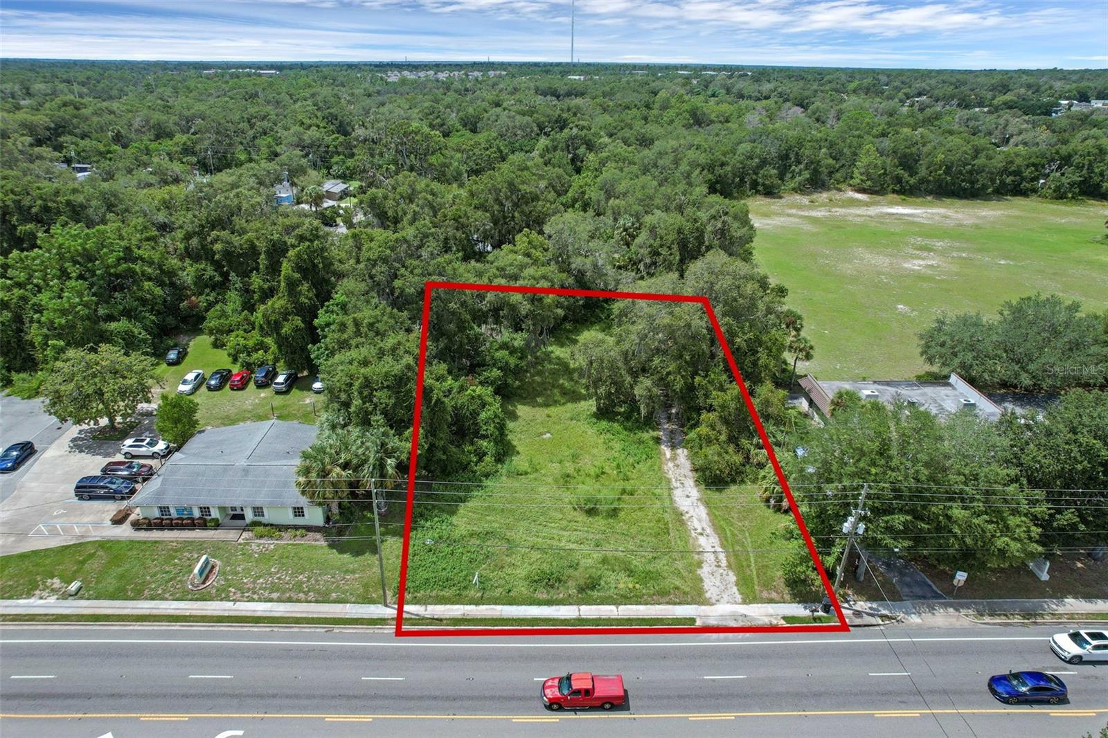 Exceptional opportunity to own a prime commercial lot located in the thriving heart of Orange City. Priced to sell, this property offers outstanding visibility with direct frontage on heavily traveled US Highway 17-92, ensuring maximum exposure for any business venture. The site is strategically positioned between two established medical facilities, making it an ideal location for healthcare-related development, professional offices, or a variety of commercial uses.
The property also benefits from strong daily traffic counts and convenient access to nearby residential communities. Within close proximity, you’ll find an array of national retailers, dining establishments, and service providers, all contributing to the area’s rapid growth and economic strength. The West Volusia region continues to expand, making this a rare chance to secure a high-demand commercial parcel in a flourishing market. Close Proximity to Highway I-4 and the Sunrail depot.
All information provided is believed to be accurate but cannot be guaranteed.