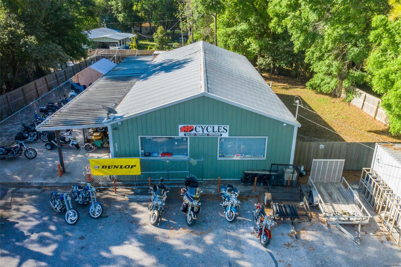 Located on a busy divided highway, 2,100 square feet of space, situated on a spacious .46-acre lot, the property features a fenced yard, along with ample parking space for up to 12 vehicles. One of the standout features of this opportunity is the option for owner financing. The MP Cycle Business is available separately for purchase.