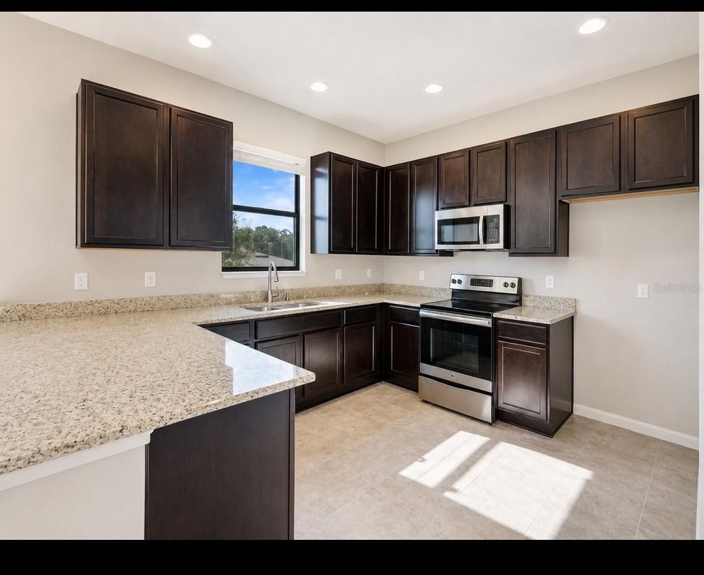 Photo of 9175 Chandler Drive, Groveland, FL 34736 (MLS # S5149934)