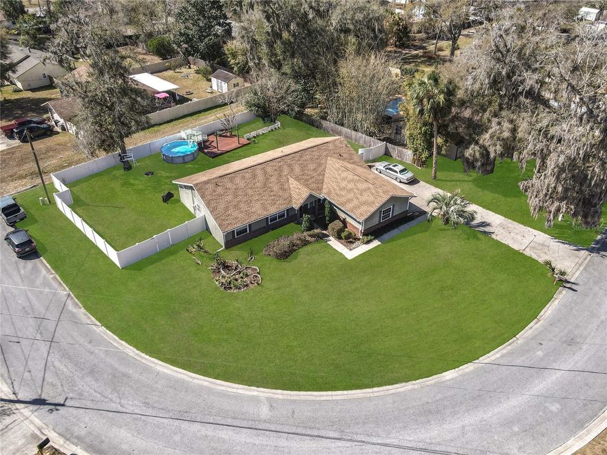 Well-maintained 3-bedroom, 2-bath home Situated on an oversized corner lot in a highly sought after SE Ocala neighborhood just minutes to downtown Ocala. This home offers comfort, functionality, and exceptional outdoor living. A vinyl-fenced backyard provides privacy and space to enjoy the Florida lifestyle. New Roof 2023
Inside, you’ll find an open split floor plan with wood-look laminate flooring throughout the main living areas, tile in the kitchen, and carpeted bedrooms for added comfort. Ceiling fans are featured throughout the home. The eat-in kitchen is equipped with stainless steel appliances, quartz counters, a charming farm sink, and ample space for casual dining.
The spacious master suite includes private access to the screened lanai and features an ensuite bath with a walk-in shower (no tub), makeup vanity desk, and linen closet. Guest bedrooms are thoughtfully positioned on the opposite side of the home and share a bath with a tub/shower combination. One bedroom has a walk-in closet ideal for storage.
Outdoor living shines with a screened lanai plus two backyard decks — one attached to the above-ground pool — creating the perfect setting for relaxing or entertaining. Additional highlights include an indoor laundry room, side-facing two-car garage, and a built-in storage shed for extra convenience.
A private and peaceful oasis, this home combines indoor comfort with versatile outdoor spaces — a wonderful place to call home. Schedule your private showing today!