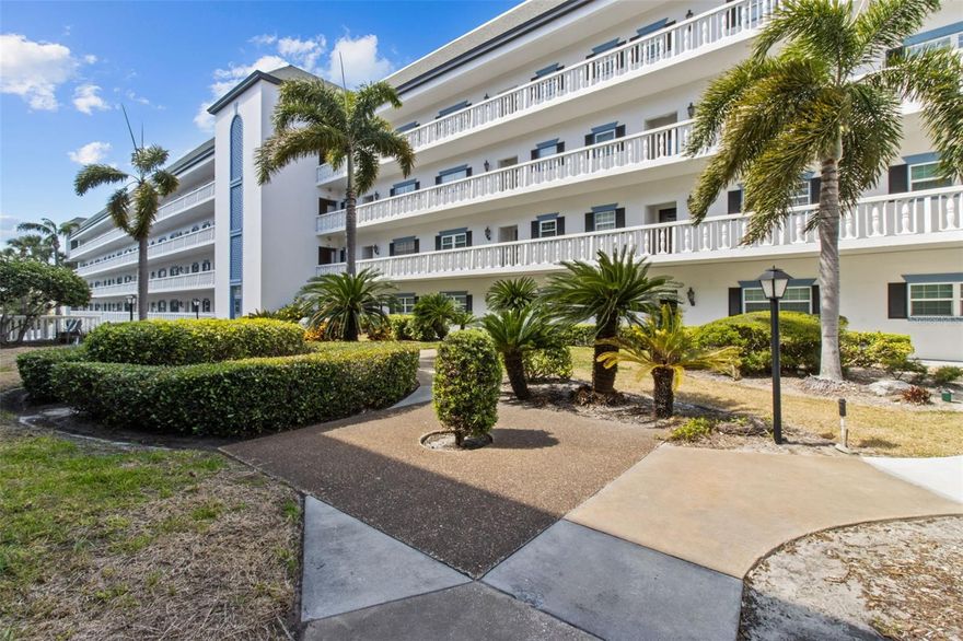 Price Reduced!!!!! Two Bedroom, two bath first floor corner unit in Port Belleair in beautiful, quaint Belleair Bluffs. This well maintained end unit can be accessed at ground level via the locked gate entering the property’s common area. Being an end unit has it’s perks, including a garden-feel from the lush plants and greens surrounding the unit. The extra windows of this corner unit allow ample natural light in the large bedrooms, open living space, and the enclosed sun room. The kitchen has Kraftmaid wood cabinets and stainless steel appliances. Wood style Laminate flooring was installed throughout in 2019. Primary bedroom features a large walk in closet and an additional large wall length closet. The ensuite primary bathroom has a large built in linen cabinet. Second bedroom has a walk in closet and ensuite bathroom with a tub. Crown molding and other decorative details throughout the unit make it feel like home. Enjoy the lovely, bright all windows sun room surrounded by nature inside the protective walls of the community. Storage closet with A/C and water heater right outside the front door, as well an additional storage unit near the laundry room. Port Belleair features a lovely heated pool and Clubhouse, and bike storage. Located high on a bluff, flood insurance is not required. Laundry room on each floor. Deeded under building assigned parking space. All current assessments have been paid by the seller. The Milestone Inspection has been completed. Restaurants, shopping and more are literally steps away from Unit 101 – no stairs!  And the beach is a one mile walk over the Belleair Causeway bridge. 45 minutes to Tampa airport. Make this your new Florida home today.