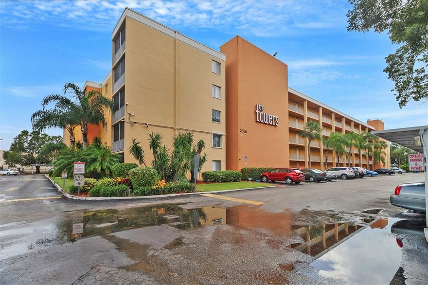 Welcome to effortless Florida living in the desirable Towers Luxury Condominium Community on E Mall Drive in Fort Myers! This beautifully remodeled first-floor unit offers the perfect combination of comfort, style, and convenience in one of the city’s most centrally located communities.

This inviting 2-bedroom, 2-bathroom condo is ideally positioned right next to the clubhouse and heated community pool, giving you immediate access to some of the community’s most popular amenities. The first-floor location also provides easy access with no stairs, making daily living simple and convenient.

Inside, the unit has been completely remodeled, creating a fresh, modern atmosphere throughout. The bright and open living space features large windows and sliding glass doors that fill the home with natural light while creating a seamless connection between indoor and outdoor living.

The modern kitchen is designed with white cabinetry, bright overhead lighting, and brand-new appliances, offering both style and functionality. Whether you're preparing everyday meals or hosting friends, the kitchen provides a clean, contemporary space that feels welcoming and efficient.

Both bedrooms are spacious and comfortable, offering plenty of room for relaxation and storage, while the two full bathrooms provide convenience and privacy for residents and guests alike.

Step outside to enjoy your private, spacious patio, perfect for morning coffee, evening relaxation, or simply enjoying the peaceful surroundings. The patio, combined with the large windows and glass doors, helps create an airy and connected indoor-outdoor feel that’s ideal for Florida living.

Residents of Towers Luxury Condominium enjoy a variety of community amenities, including a heated swimming pool, grilling areas, a landscaped courtyard, and clubhouse access. The community also offers covered carports and convenient on-site parking, including one assigned parking space for the unit.

Location is another standout feature. The property is within walking distance of Edison Mall, as well as numerous shops, restaurants, and shopping plazas, making everyday errands and dining out incredibly convenient.

With its modern updates, bright interior, spacious patio, and unbeatable location, this move-in-ready condo is perfect for year-round living, seasonal residents, or investors looking for a well-located Fort Myers property.

Don’t miss the opportunity to own this beautifully updated home in a vibrant and convenient community. Schedule your private showing today and discover the comfort and lifestyle that await at Towers Luxury Condominium.