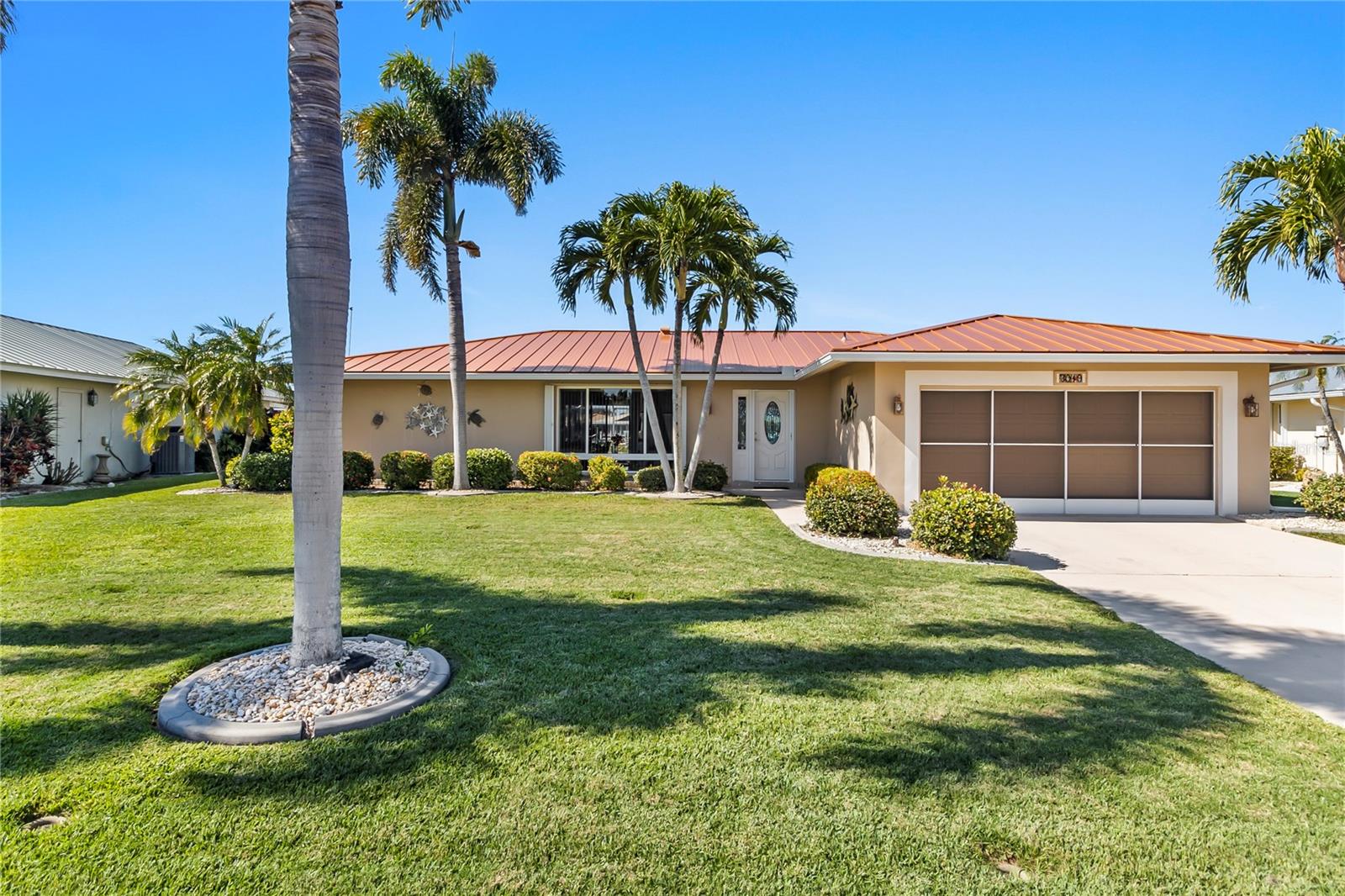 Waterfront pool home in beautiful Punta Gorda Isles! Boat from your backyard or watch the sunsets while floating in the spacious heated pool. The saltwater canal out back leads to Charlotte Harbor and on to the Gulf. The pool has recently been resurfaced, and the cage was rescreened, along with a new pool pump. New metal roof in 2024 as well as new AC in 2024! A new dock was installed in 2011 and a new 10k boatlift was added the following year. The kitchen was updated in 2014, as well as the bathroom cabinetry. Utilities are city water and sewer, and the seawall is maintained by the City of Punta Gorda. This home is in a quiet neighborhood, minutes from downtown Punta Gorda with shopping, dining, waterfront parks, walking and biking paths, art galleries, Fishermen's Village, Charlotte Harbor Event Center and weekend farmer’s markets.