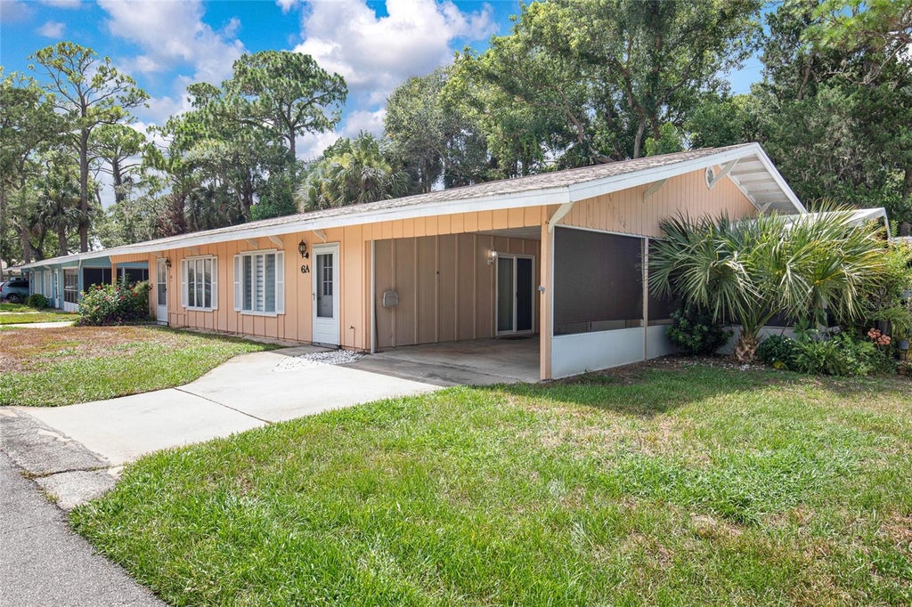 Photo of 6 Country Club Drive #A, New Smyrna Beach, FL 32168 (MLS # O6426571)