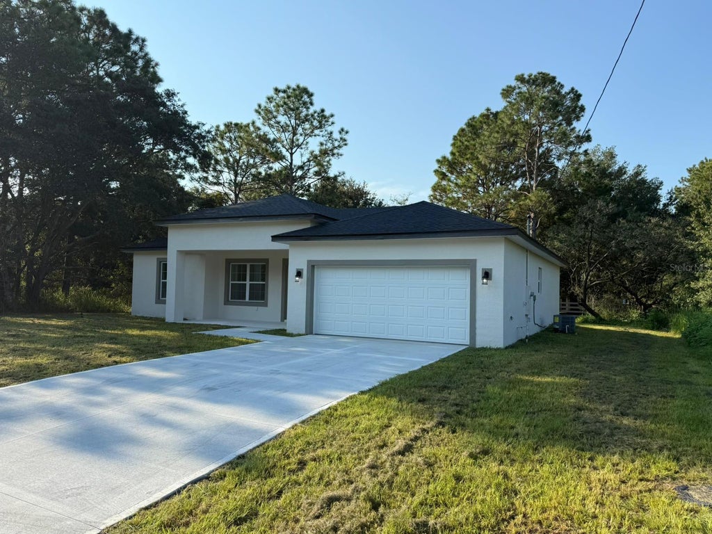 Photo of 2382 W Paragon Ln, Citrus Springs, FL 34434 (MLS # O6440591)