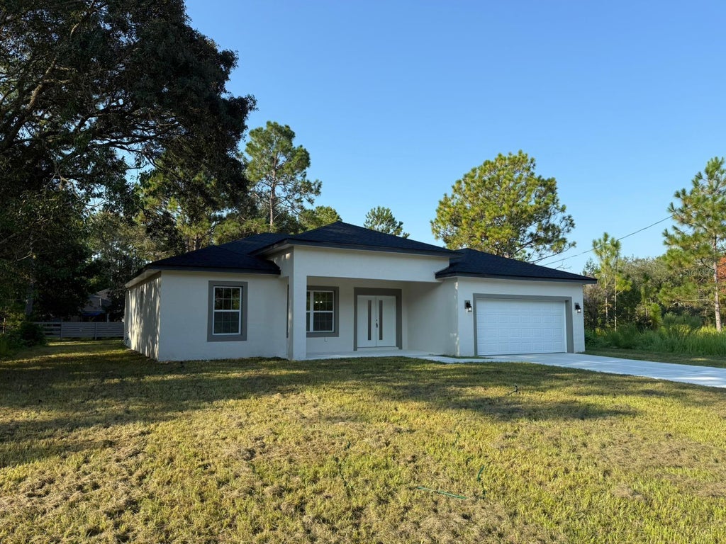 Photo of 2382 W Paragon Ln, Citrus Springs, FL 34434 (MLS # O6440591)