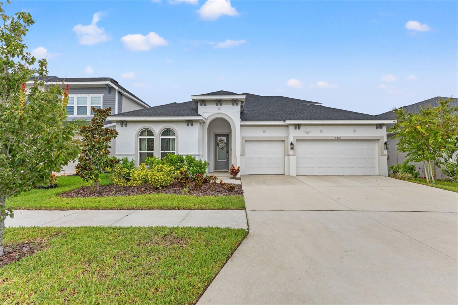 Welcome to 5418 Wayfarer Ave, located in the sought-after community of Waterset in Apollo Beach! Built by David Weekly Homes, the Rivergate Bonus Floor Plan home features five bedrooms, four bathrooms and a three car garage in over 4,312 sq. ft. (3,458 heated). This home is fully fenced and equipped with Solar Panels. Step inside to find an open floor plan with abundant natural light, white cabinets with white quarts in the kitchen, with extra storage and shelving/cabinets in the dining area. This floor plan features a relaxing primary suite with an en-suite bath, on the first floor. The additional bedrooms provide plenty of space for family, guests, or a home office. The bonus room is huge! Perfect for a game day, a playroom, a work from home office are, you can make this space your own. The large sliding glass doors lead to an oversized covered lanai with a fenced backyard and a conservation view behind the house.
The Waterset Community is Master Planned Community with thoughtful layout that creates a sense of cohesion. Offering on site HOA/CDD offices which helps addressing questions and issues quickly. Here, you can enjoy multiple pools (resort-style + lap pools) so you’re not stuck waiting. Fitness centers spread through the community. A wide variety of sports courts: pickleball, tennis, basketball, sand volleyball. There’s many parks, playgrounds, splash pads, dog parks, picnic and BBQ areas. For parents there’s a Kids R’Kids Daycare center right down the street! There’s Trails, Green Space, and Outdoor Lifestyle. Over 12-14 miles of walking/jogging/biking trails, scenic lakes & greenways. There’s many open-spaces and parks, which are great for anyone who loves the outdoors, has pets, or just enjoying the green scenery. The Waterset HOA is ONLY $135 per year!
Apollo Beach, where suburban communities are full of amenities and coastal charm. Just minutes away you’ll find Apollo Beach Nature Preserve, waterfront dining, boating and fishing on Tampa Bay, and the Manatee Viewing Center, a local favorite. For schools, this home is zoned for Apollo Beach Elementary, Eisenhower Middle School, and Lennard High School, all within close reach.
Whether you’re looking to entertain at home or explore the Apollo Beach areas, this property delivers the best of both worlds with easy access to Tampa, St. Pete, and Sarasota via I-75. This home is located behind a main road with a fence and lush trees/greenery for separation. Please don’t bother setting up tours if that bothers you.