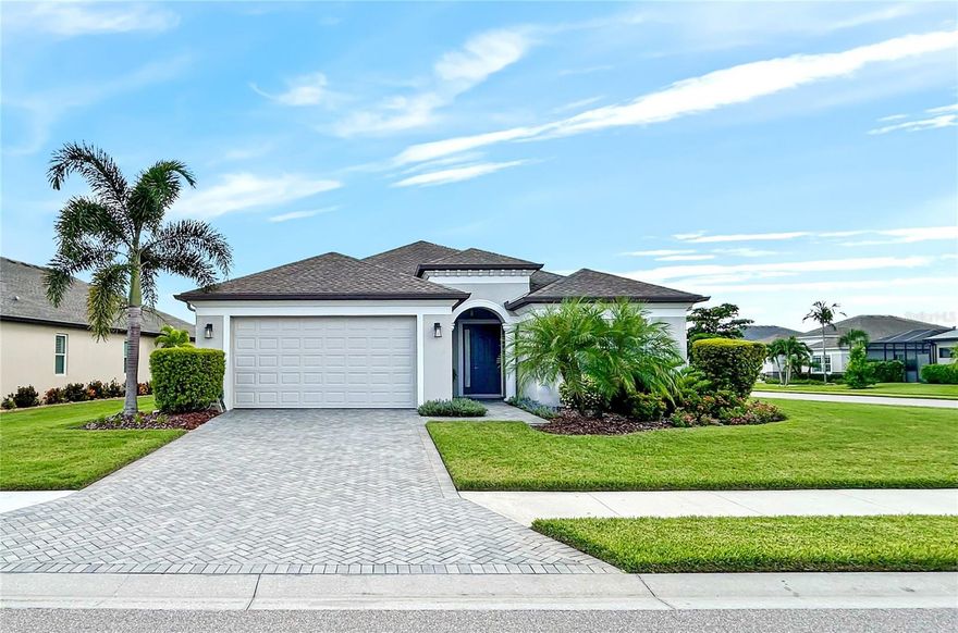 Welcome to this stunning Allura model from Homes By Towne.  Located in this sought-after community of Greyhawk Landing with 24-hour gated security.This impeccably kept home built in 2019 boasts many upgrades and features:  3 bedrooms and 2 full baths, 1827 square feet with a 2-car garage.  The owner's suite includes an oversized walkin closet, a primary bath with his and her sinks, quartz counter tops and a tiled shower with niche.  The second bath also includes a quartz counter top and a tub with tiled walls with niche.  Additionally, there is a dedicated laundry room with a quartz counter top, a utility sink, upgraded cabinets and drawers for extra storage and a washer and gas dryer.  The kitchen features corian counter tops, upgraded slate finish appliances, a large center island a large center island, oversized stainless steel single sink, 2 sliding shelves in lower cabinet for pots and pans, pull out trash /recycle bin, under cabinet lighting and large walk-in pantry. 

Three glass sliders in the great room will lead you onto the spacious (30' x 11 ') covered screened lanai.  he features of this home boast 9' ceilings throughout and a 12' ceiling in the great room, Daltile flooring throughout the living area with carpeting in the bedrooms. Bathrooms include comfort height toilets. There are soft close cabinets and drawers with Moen plumbing fixtures throughout. Home includes an in-wall pest tube system, gas hot water heater, metal hurricane shutters and exterior rain gutters. This home is located on a large corner lot with mature palms in the backyard which provide privacy and ample space for a future pool. 

Greyhawk Landing is a 24-hour gated community with a guard in place. Low HOA Fees of $70.00/year. This community features everything a family is looking for. There is a heated community lagoon style resort pool, spa, fitness center, tennis, pickle ball courts, lighted basketball court, playground, soccer field, baseball field, fishing pier, walking and biking trails. There's also a second beautiful community pool and spa with a clubhouse for gatherings, fitness classes and water aerobics located within the Grayhawk Landing community. This home is convenient for top rated schools, shopping, dining, medical facilities, two international airports, golf courses, boating facilities and near Lakewood Ranch, Sarasota and Tampa. Take advantage of the gorgeous and pristine Florida beaches just a short drive away. Enjoy additional family fun at major attractions that are approximately an hour to two hours away including Busch Gardens, Walt Disney World, Sea Word and Universal Studios. Conveniently located near 1-75, Lakewood Ranch and The Market Place at Heritage Harbor.

Schedule an appointment now to see what your new home and lifestyle can be!