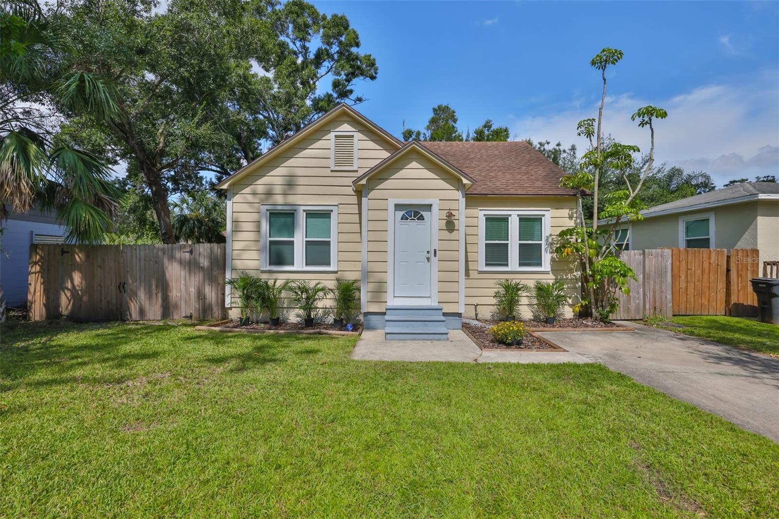 Move right in to this very inviting and perfectly maintained 2 bedroom/1bath home complete with dining area and separate living room. For peace of mind, all major expenses have been addressed. This house was professionally updated throughout and features granite counters and SS appliances in the kitchen, updated bathroom complete with granite and glass shower doors, laminate flooring throughout, and updated electrical. The roof, windows, doors, and AC were replaced in 2018. For additional appeal, you can enjoy your own outdoor oasis in the large and dry, fully fenced back yard... a beautiful setting for entertaining, gardening or just relaxing. This Flood-Zone-Free home is conveniently located just off Gandy Blvd, making the location very appealing with easy access all major roads and highways, downtown Tampa, beaches and everything St Pete has to enjoy. As an added note, there is no history of any water damage...a perfectly dry and delightful home!