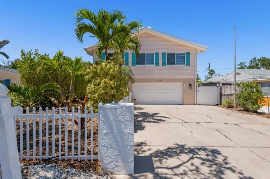 Updated Indian Rocks Home - short walk to the beach.  This is a great opportunity to own a SUCCESSFUL and ESTABLISHED vacation rental in Indian Rocks Beach!! Whether you choose to live in this home full time or use it to generate income, this oasis is packed with comfort, relaxation, entertainment and more that can be enjoyed by everyone. This beautiful 4-bedroom, 3-bathroom home comfortably accommodates 12-14 guests, making it ideal for multiple families or one large family. With 2 stories, there is plenty of room to relax and unwind without feeling crowded. The ground level is equipped with a kitchenette, living room, full bathroom and large bedroom with 2 full beds providing the opportunity for space and privacy if needed. The garage has been converted into a game room featuring a flat screen tv and plenty of games to enjoy. The top floor has 3 cozy bedrooms and a beautiful open kitchen and separate dining area. Take full advantage of all Florida has to offer with the private outdoor space! With an array of amenities from the beautiful heated swim spa, to the additional lounge areas and putting green, there is something for everyone to enjoy. Take a walk to the beautiful world famous Indian Rocks Beach and catch sunset, or enjoy a morning swim, the opportunities are endless with this prime beach oasis!  2025 PROJECTED GROSS RENTAL INCOME = $75++