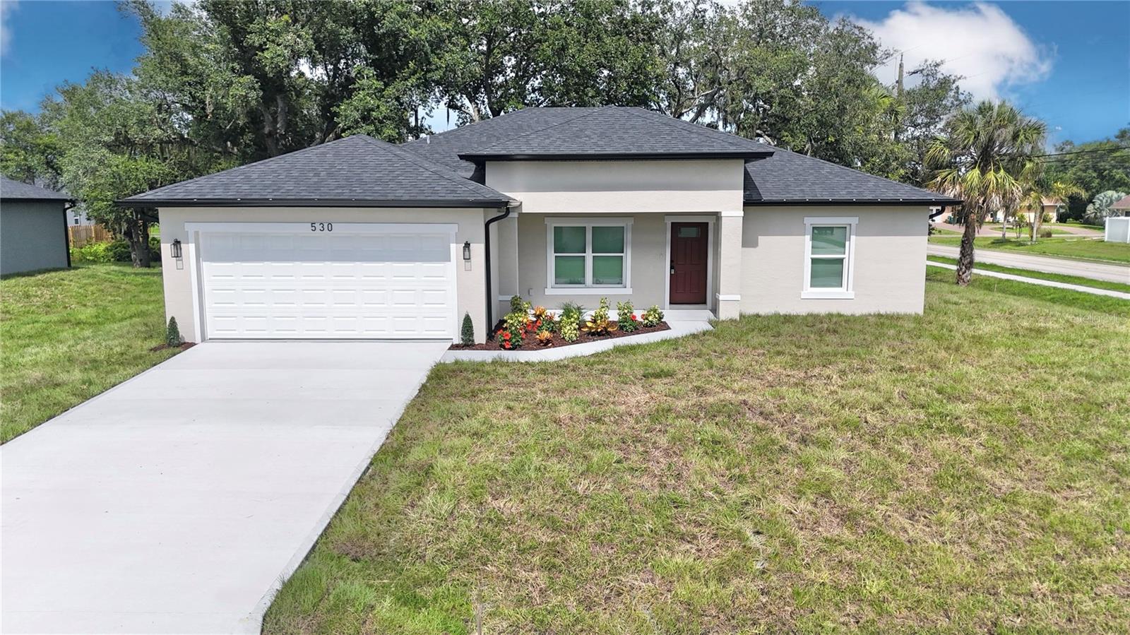 BRAND NEW - NO HOA home located in one of the most desirable areas of Port Charlotte!! This builder is offering a 2-10 Home Buyers Warranty which covers 1 Year Workmanship/ 2 Year Systems/ and 10 Year Structural!! This 1,842 square foot modern home features high impact windows, window blinds, rain gutters, 2 CAR Garage with openers, high ceilings with an open style floor plan that has 4 spacious bedrooms that include ceiling fans in all of the bedrooms and 2 full baths. Throughout the home you'll see Luxurious Vinyl Plank Flooring and beautiful Porcelain Tiles in the bathrooms. The kitchen features plenty of Wood Cabinetry along with Elegant Quartz countertops, Stainless Steel Appliances, and a Breakfast Bar. The kitchen flows effortlessly into the family room that has glass sliding doors that lead into the covered Lanai which is perfect for outdoor activities and entertaining! Conveniently located near hospitals, schools, shopping centers, I-75 & US-41. Short drive to the Charlotte Harbor and Historic downtown Punta Gorda where you’ll find waterfront dining & marinas! Close to beaches like Englewood, Venice Beach, and Boca Grande which is perfect for fishing! This BRAND NEW BLOCK CONSTRUCTION home on CITY WATER sitting on a HUGE lot is ready for you to call it home!!