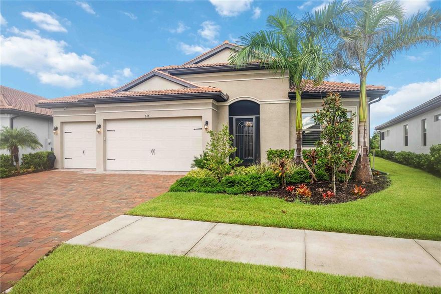 Welcome to this exquisite 3-bedroom, 5-bathroom residence spanning 2,540 square feet in the exclusive gated community of Toscana Isles. Built in 2023, this modern home blends luxury and functionality with thoughtful upgrades throughout. Step inside to discover an open-concept layout featuring luxury vinyl plank flooring over ceramic tile, providing both durability and elegance. The gourmet kitchen is a chef's dream, equipped with premium Bosch appliances, while the adjacent laundry room boasts high-efficiency LG washer and dryer units. The living spaces are adorned with stylish Italian furniture, creating an inviting atmosphere ready for immediate enjoyment. The primary suite offers a serene retreat with an en-suite bath, complemented by two additional bedrooms, each with private baths for ultimate comfort and privacy. A versatile den or office space adds flexibility for remote work or hobbies. Outdoors, entertain in style on the expansive lanai, highlighted by a beautiful tongue-and-groove ceiling and a fully equipped outdoor kitchen. Relax with the premium RH outdoor furniture set, perfect for al fresco dining while overlooking the lush, maintenance-free landscaping, infinity spa (also known as a champagne spa), and numerous water features on a generous nearly 10,000-square-foot lot. Residents of Toscana Isles enjoy resort-like amenities, including an infinity-edge pool, state-of-the-art fitness center, tennis and pickleball courts, bocce ball, a dog park, kayaking and fishing on scenic lakes, and a vibrant clubhouse with planned community events. Conveniently located near pristine beaches, shopping, and dining, this home offers the ideal Florida lifestyle.