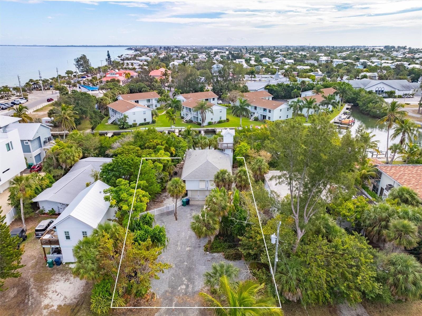 Discover the perfect canvas for your dream home on Anna Maria Island! This 10,500 sq ft lot with 70 ft of canal frontage, provides an incredible opportunity for a new build. Don't miss this chance to own a prime piece of Anna Maria Island real estate.